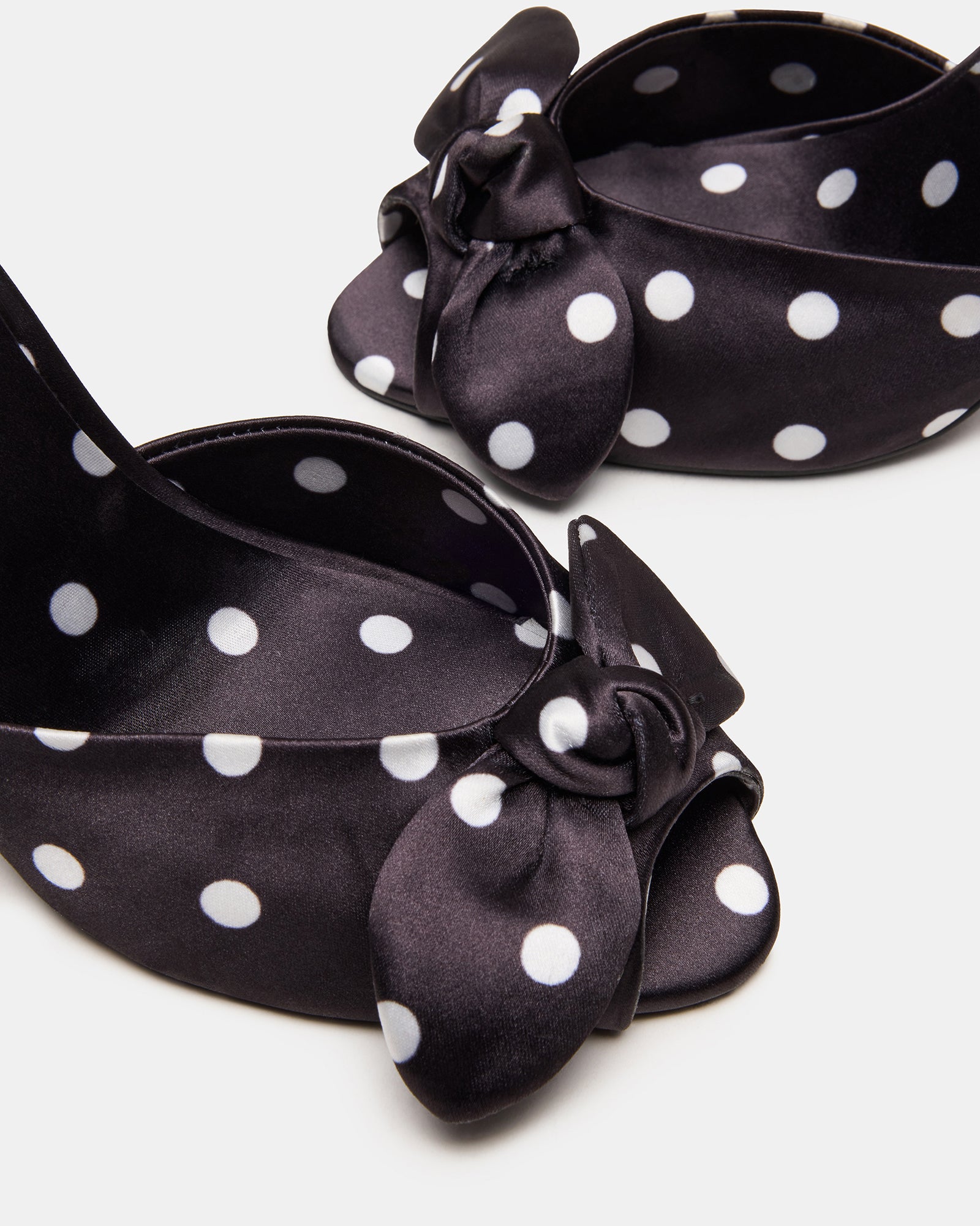 Stylish mules worn on a fashionable outing, highlighting their versatility.