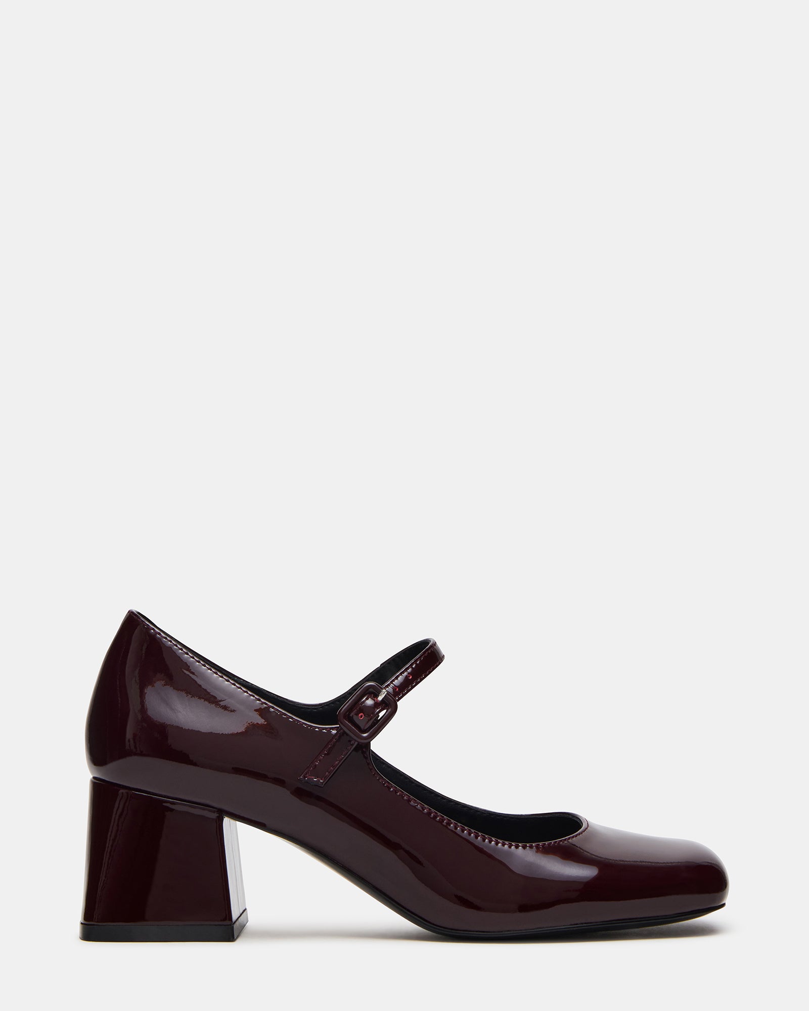 Close-up of Darcey Wine Patent loafers highlighting the block heel and leather texture.