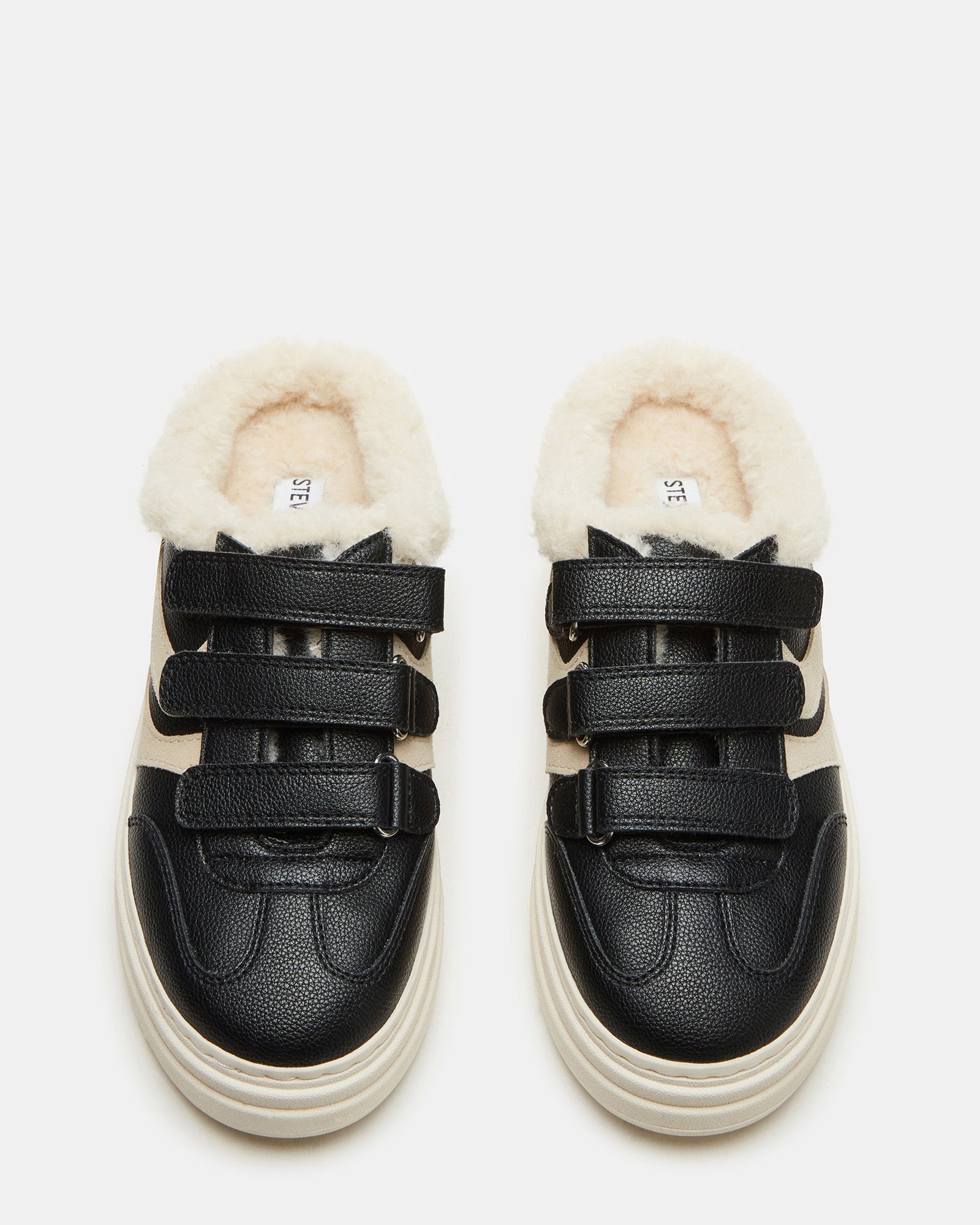 Side view of DASHER black faux fur platform sneakers showcasing the slip-on style and 2-inch heel