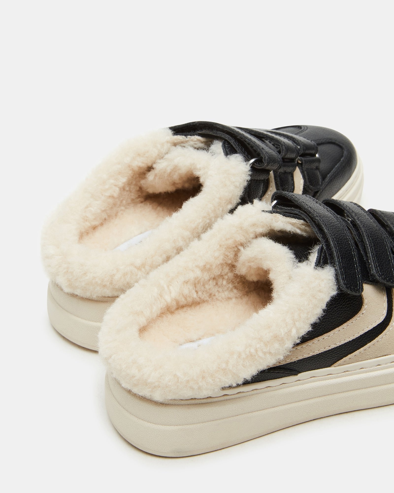 Fashionable women’s slip-on shoes with faux fur detail suitable for casual outings