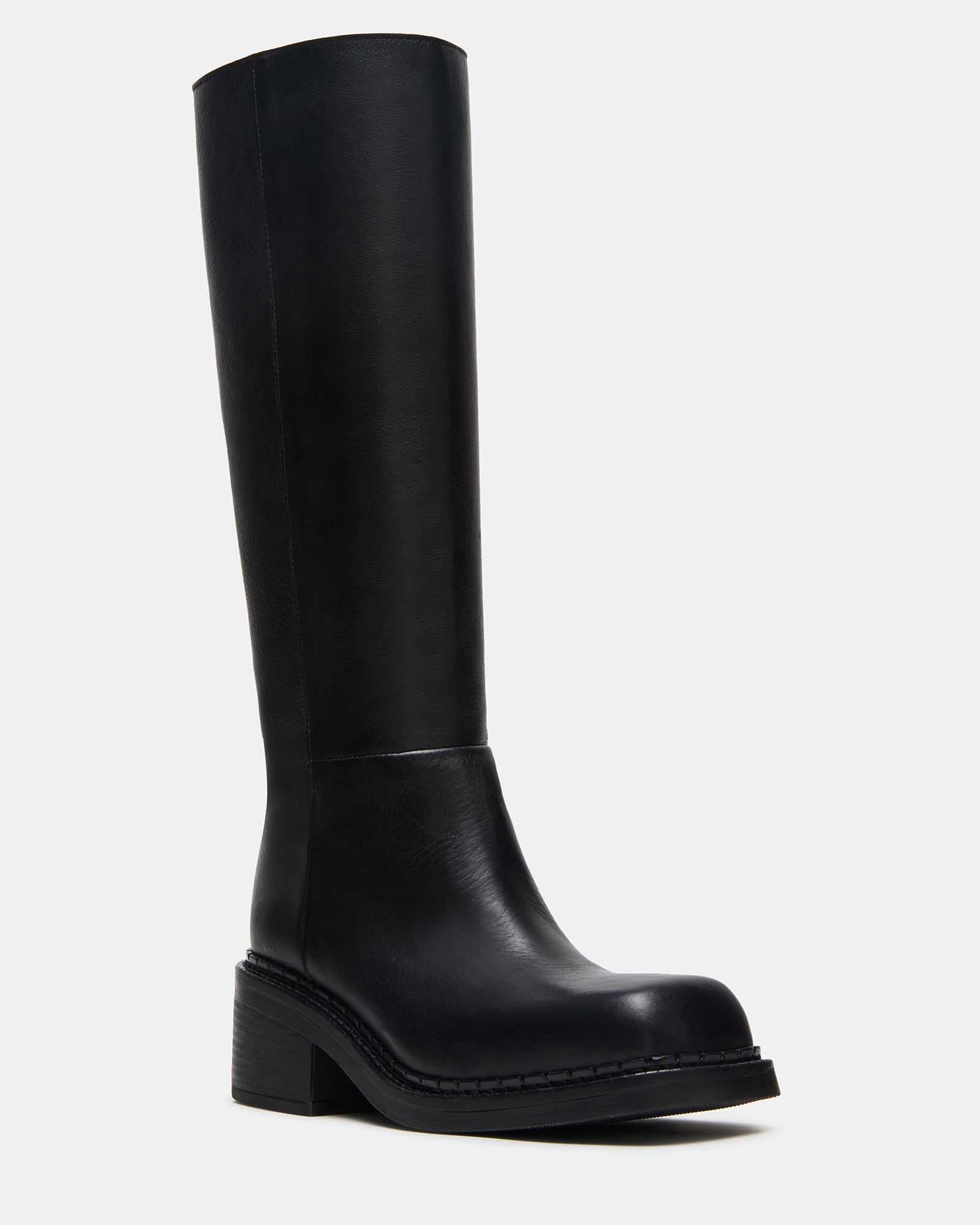 Black leather boots styled with denim for everyday wear.