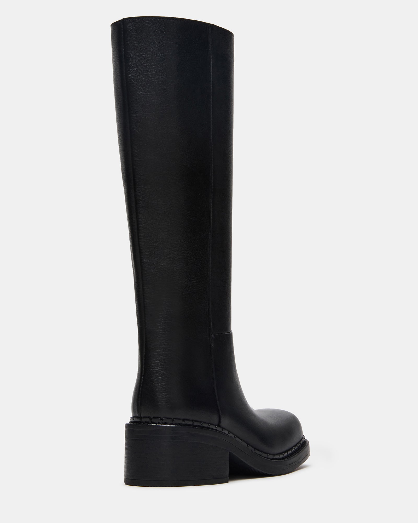 Black leather boots styled with denim for everyday wear.