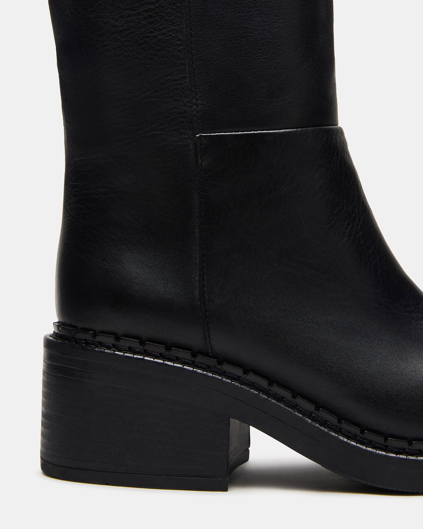 Knee-high boots in rich brown leather shown from side profile.