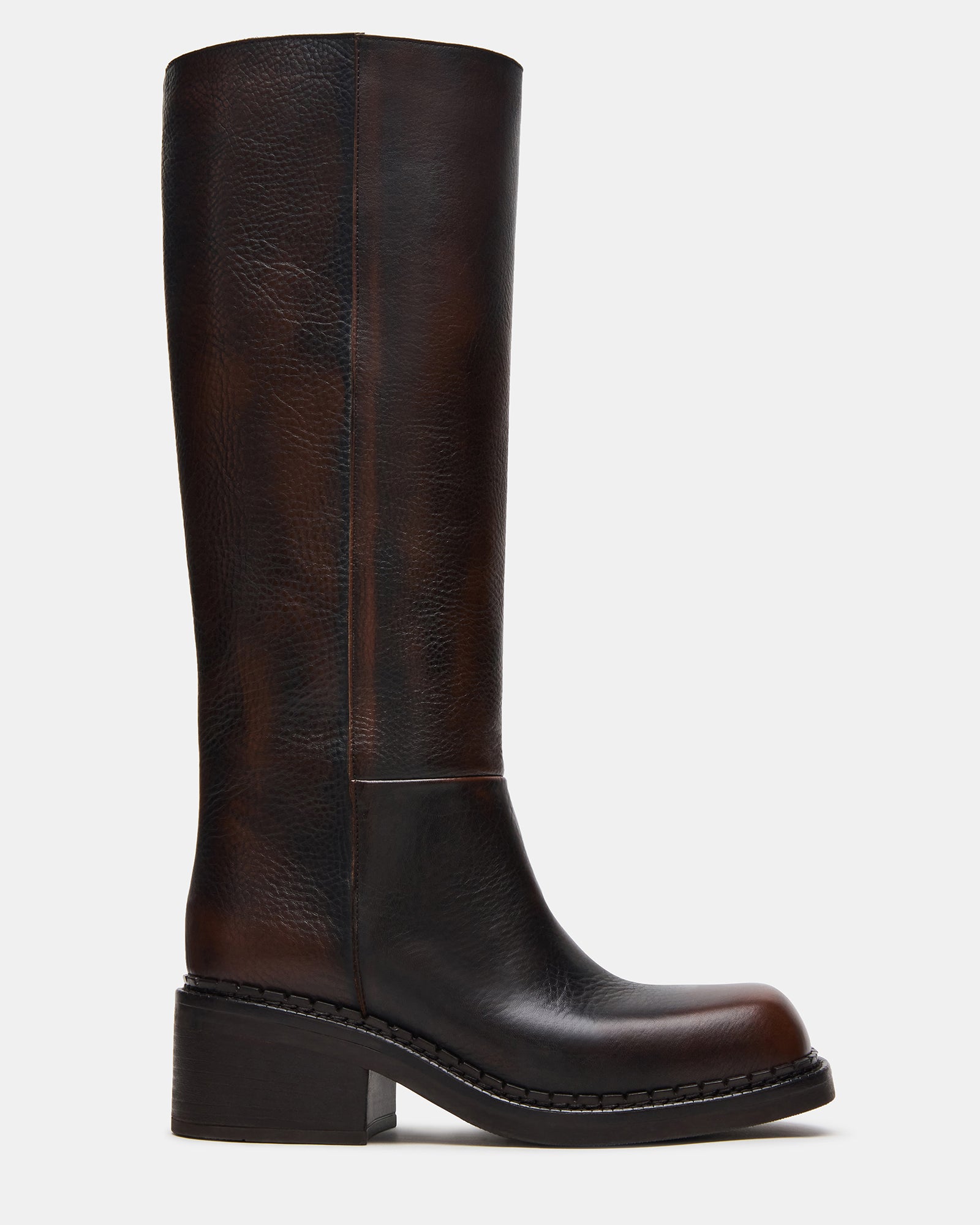Side profile of brown knee high boots showing square toe and heel height