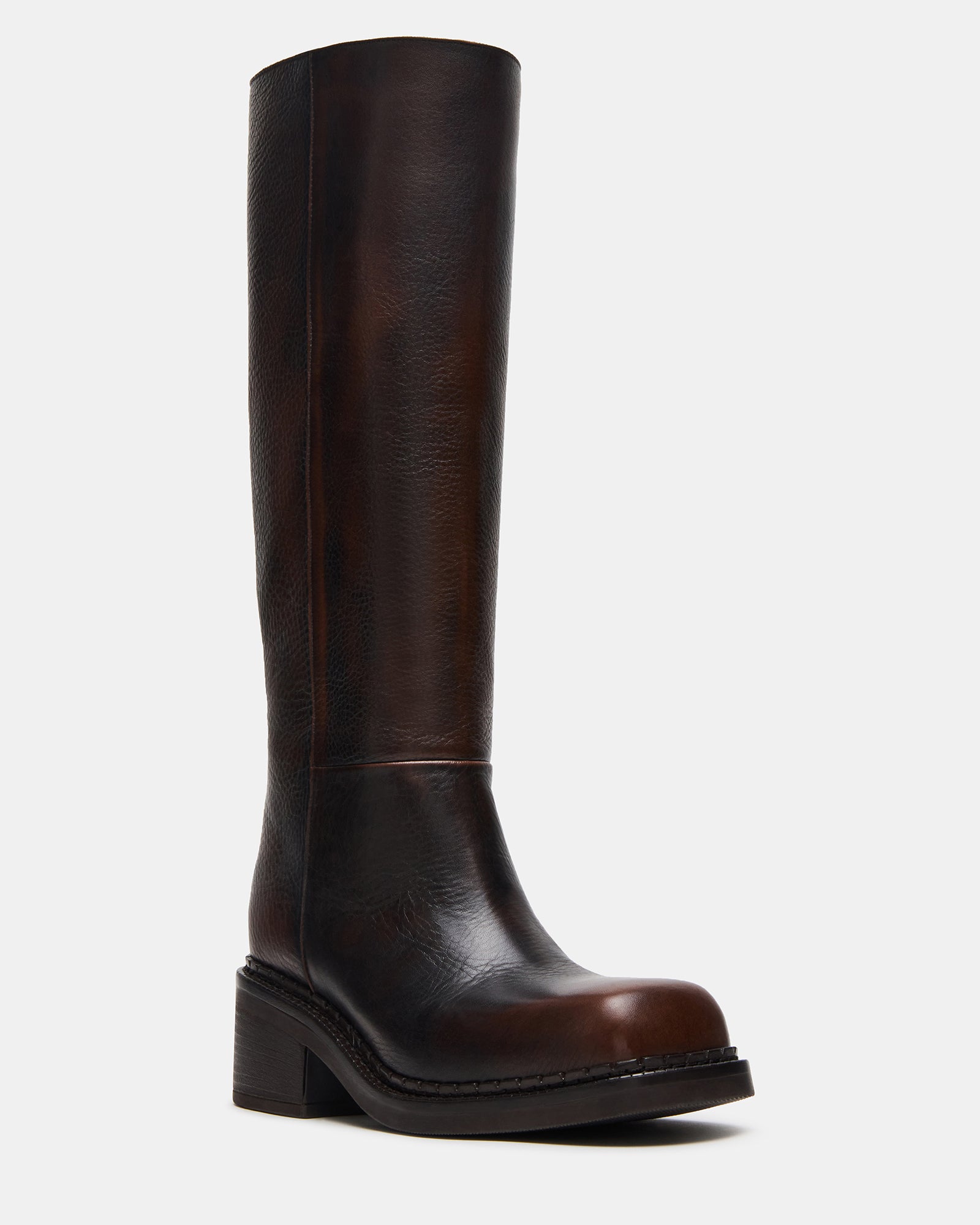 Front view of leather boots styled with fall outerwear in Chicago street setting