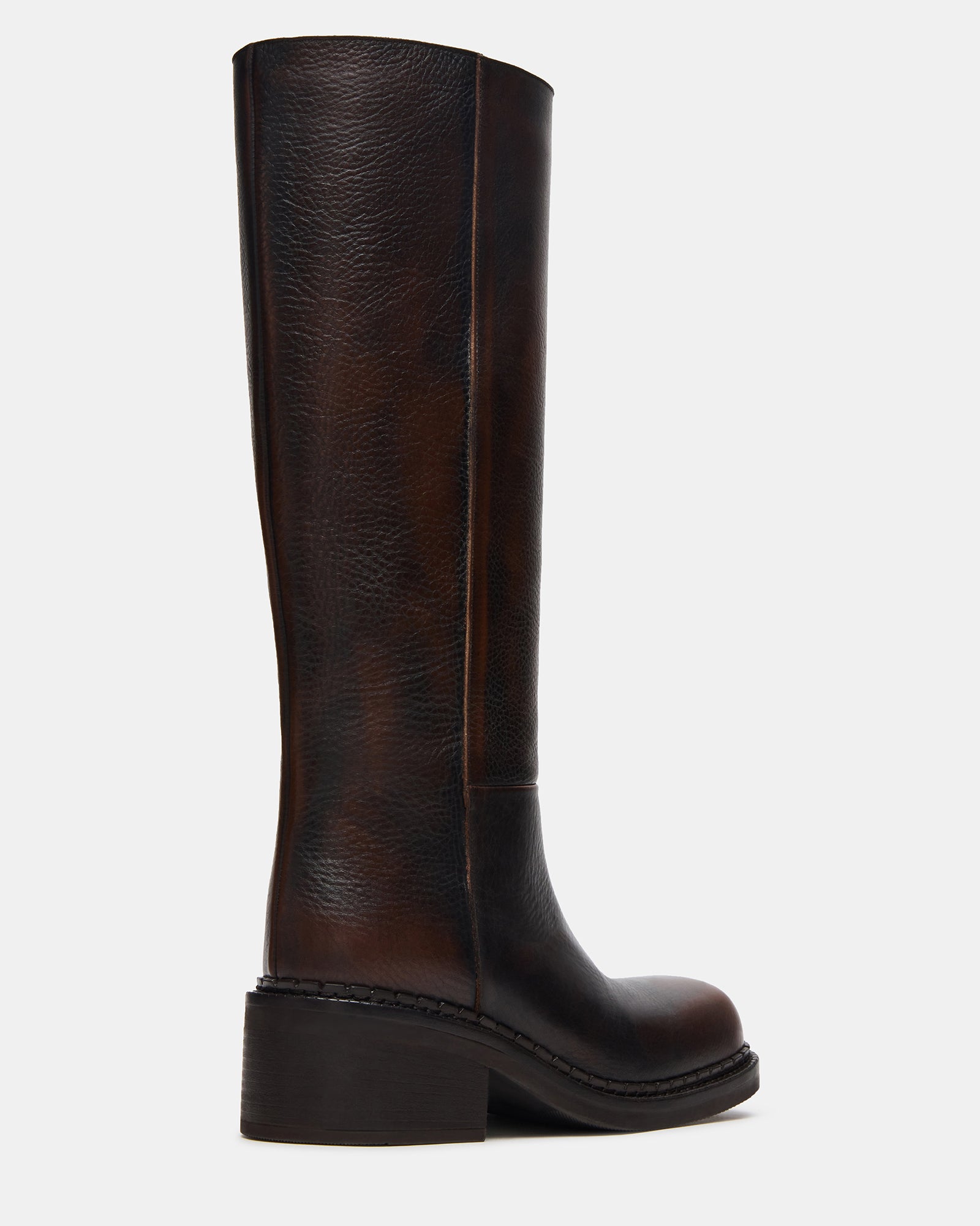 Front view of leather boots styled with fall outerwear in Chicago street setting