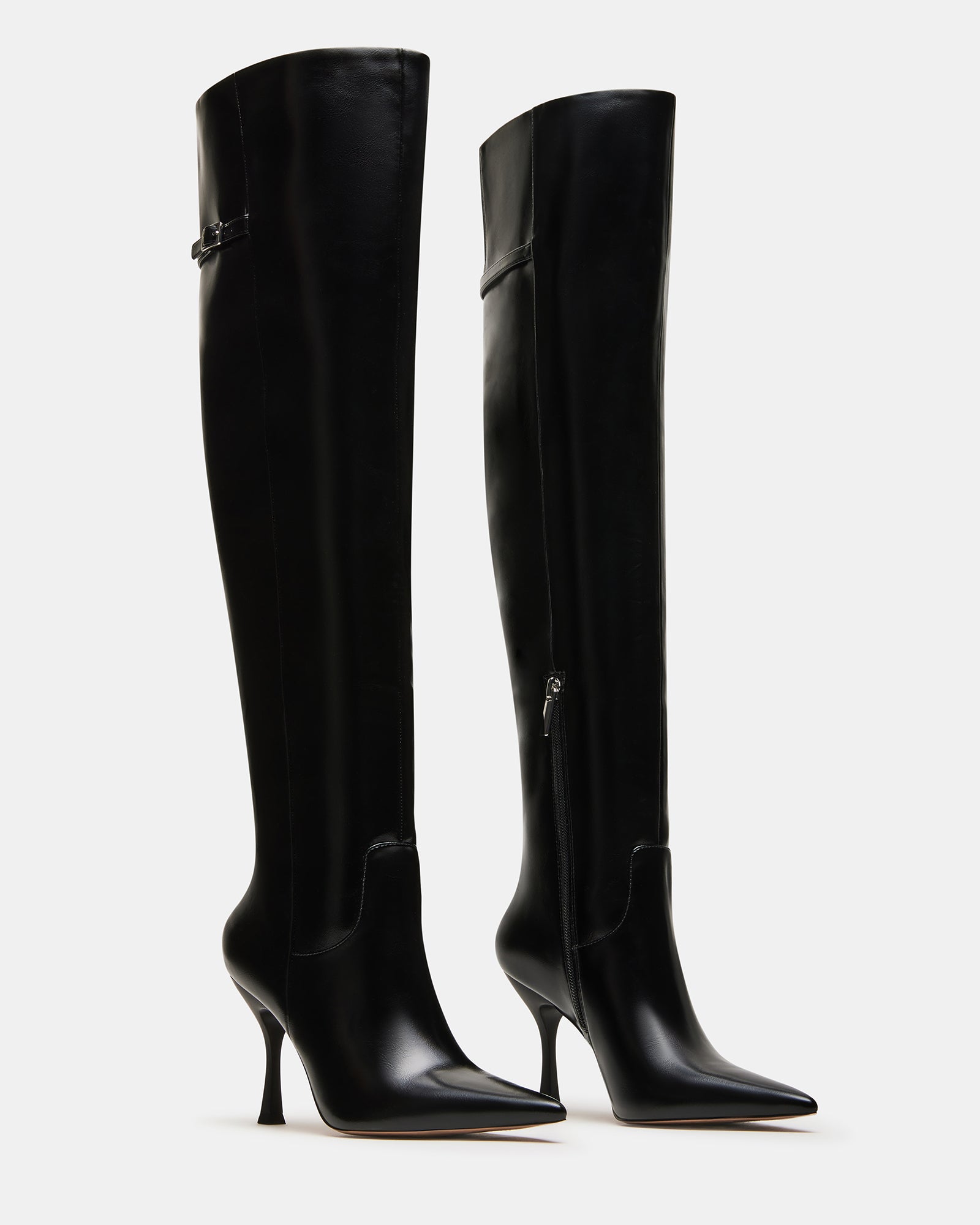 Wide calf knee high boots styled with jeans for everyday wear