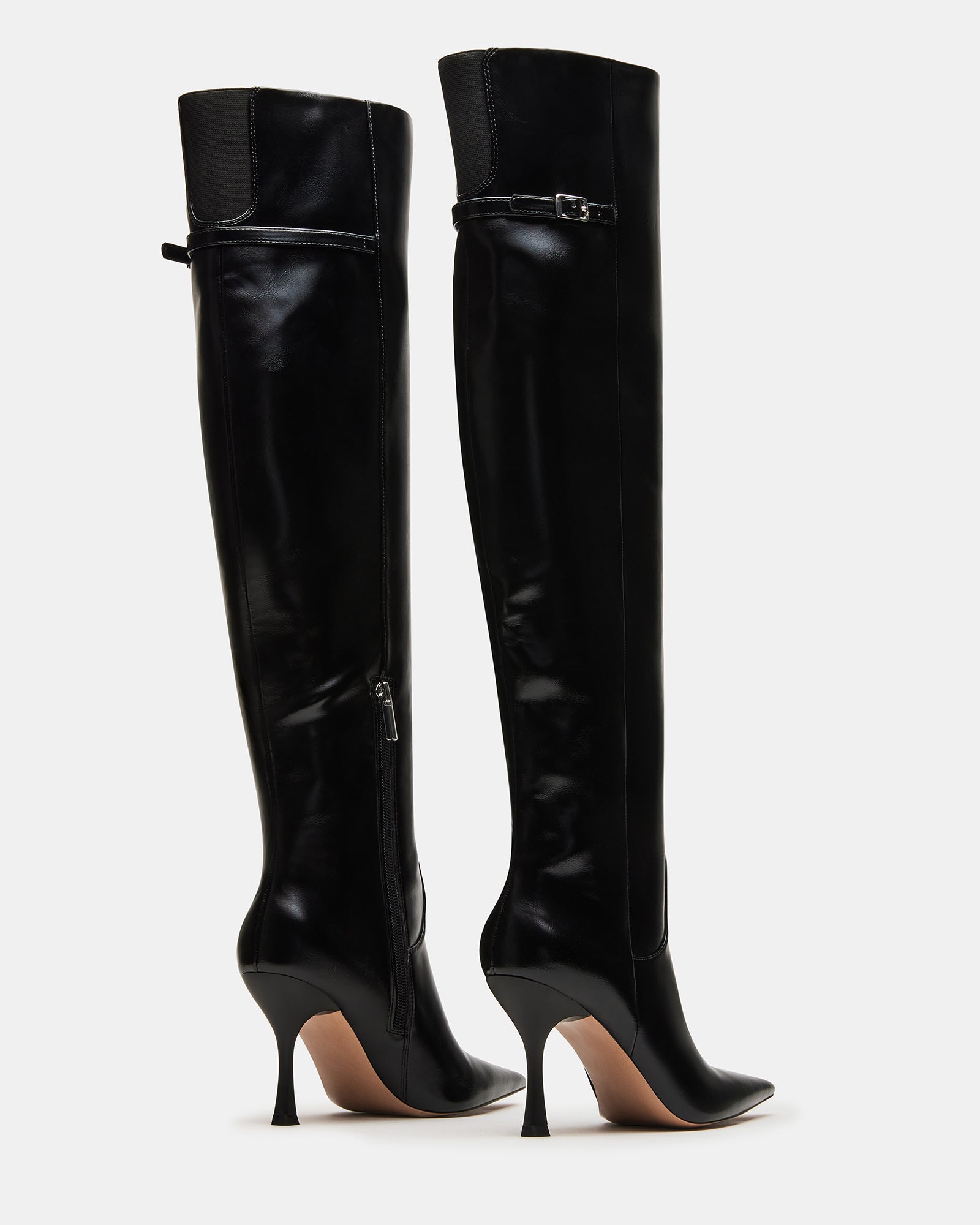 Wide calf knee high boots styled with jeans for everyday wear