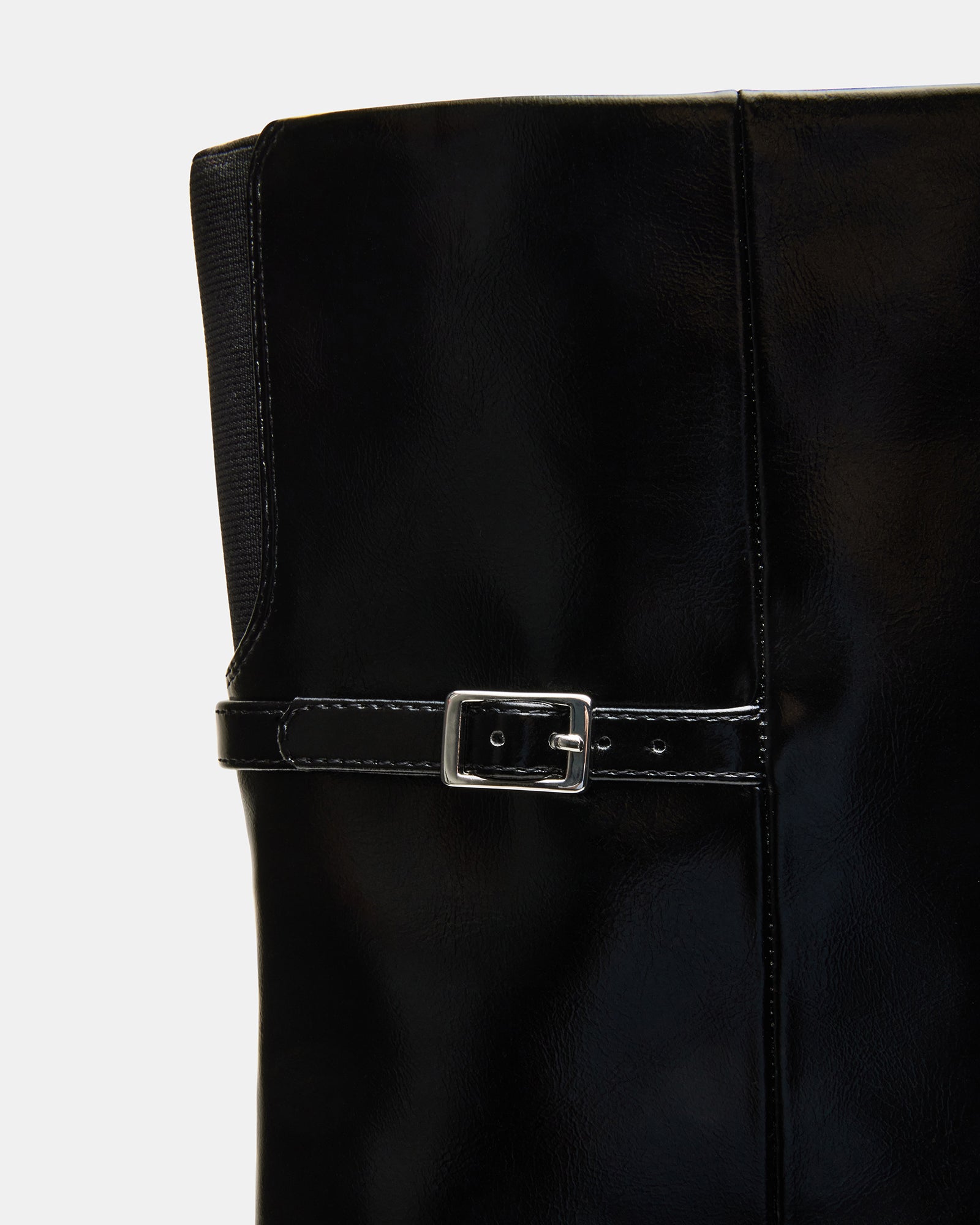Side profile of vegan leather knee-high boots with pointed toe