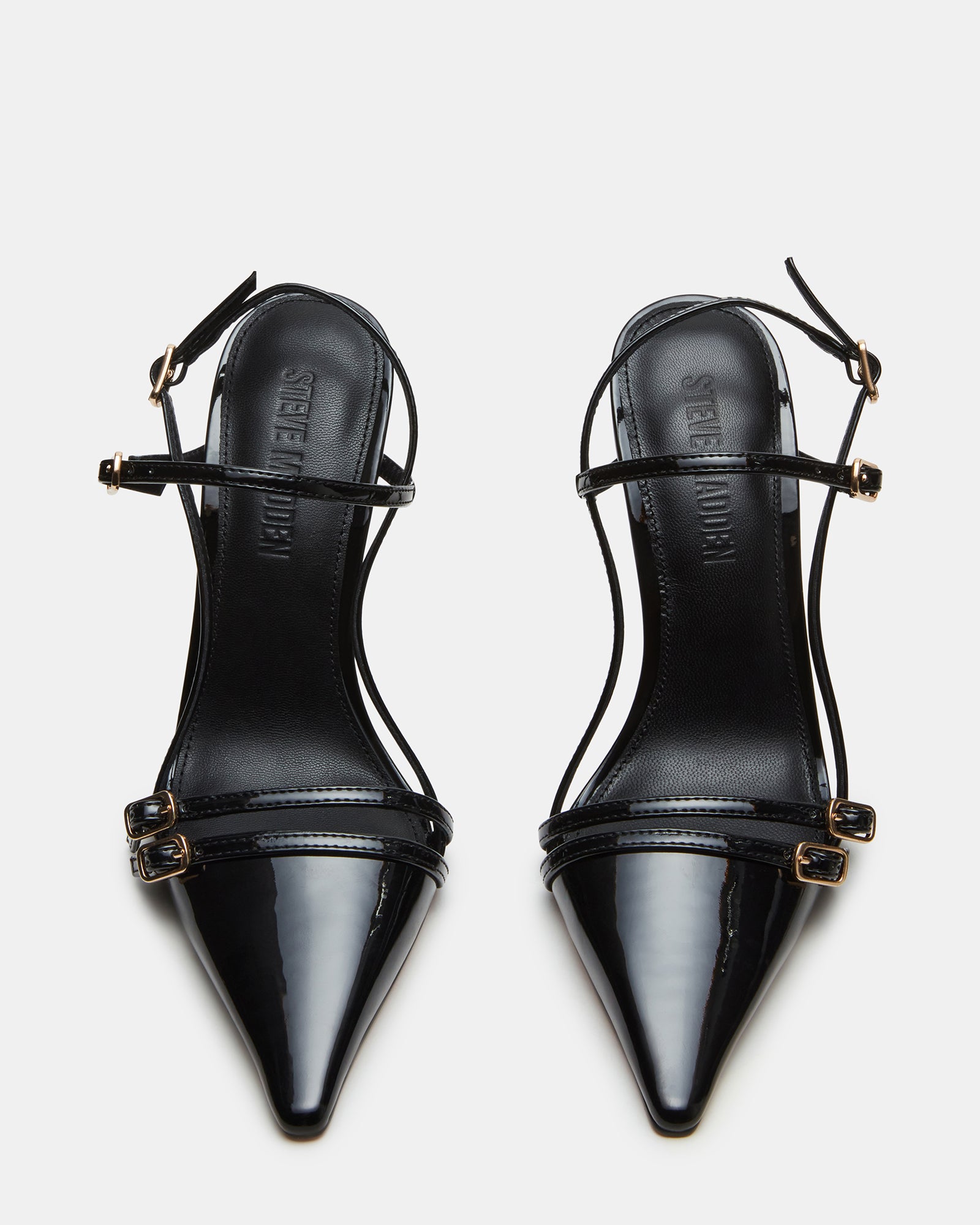 Close-up of the sleek strappy design on the black patent heels
