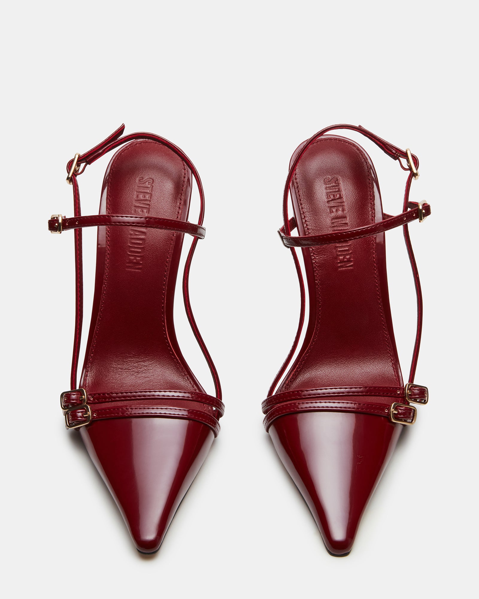 Close-up of Deagan heels highlighting the pointed toe and sleek finish.