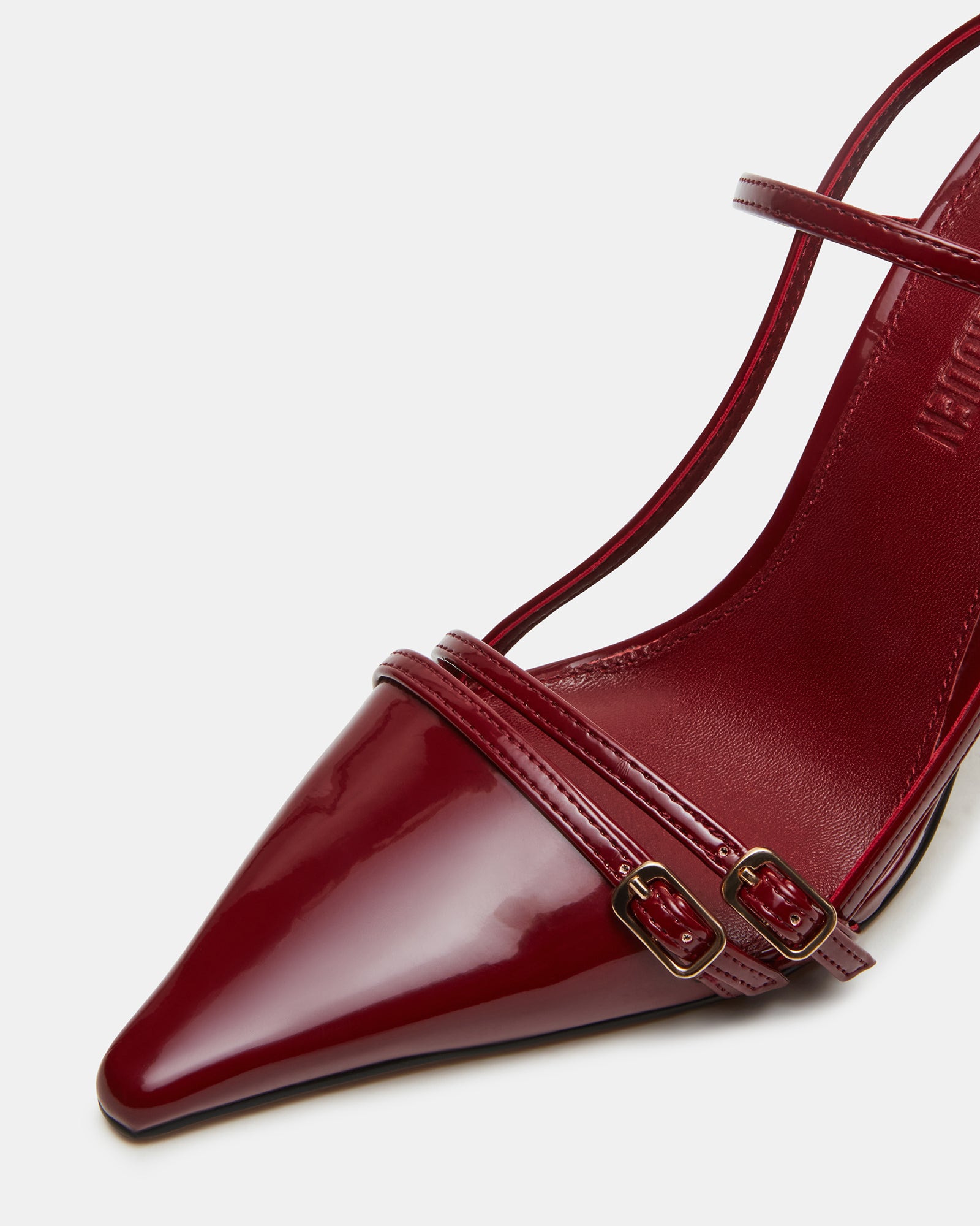 Side view of Deagan patent slingback heels showcasing strappy design.