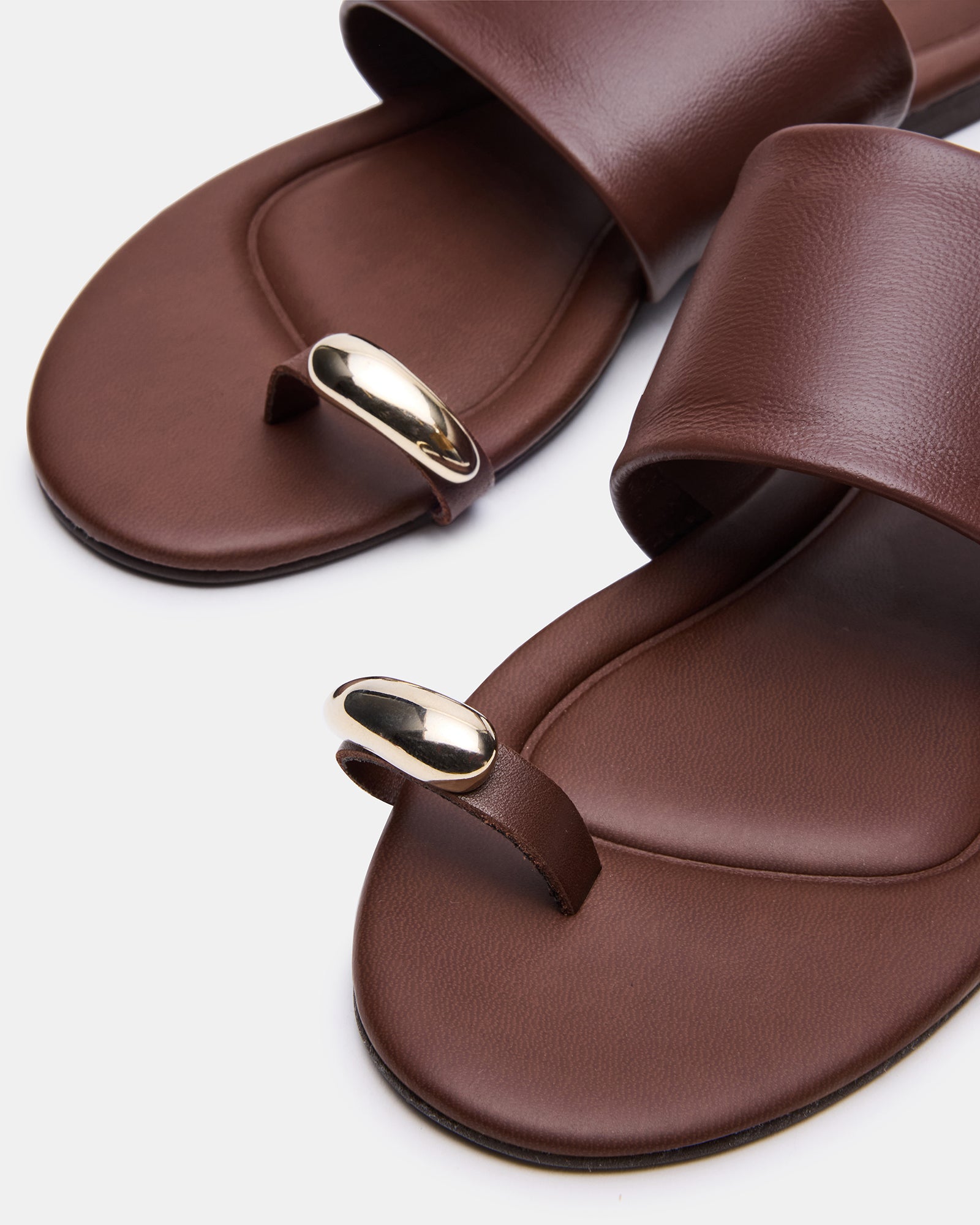 Top view of leather sandals highlighting the sleek silhouette and premium material
