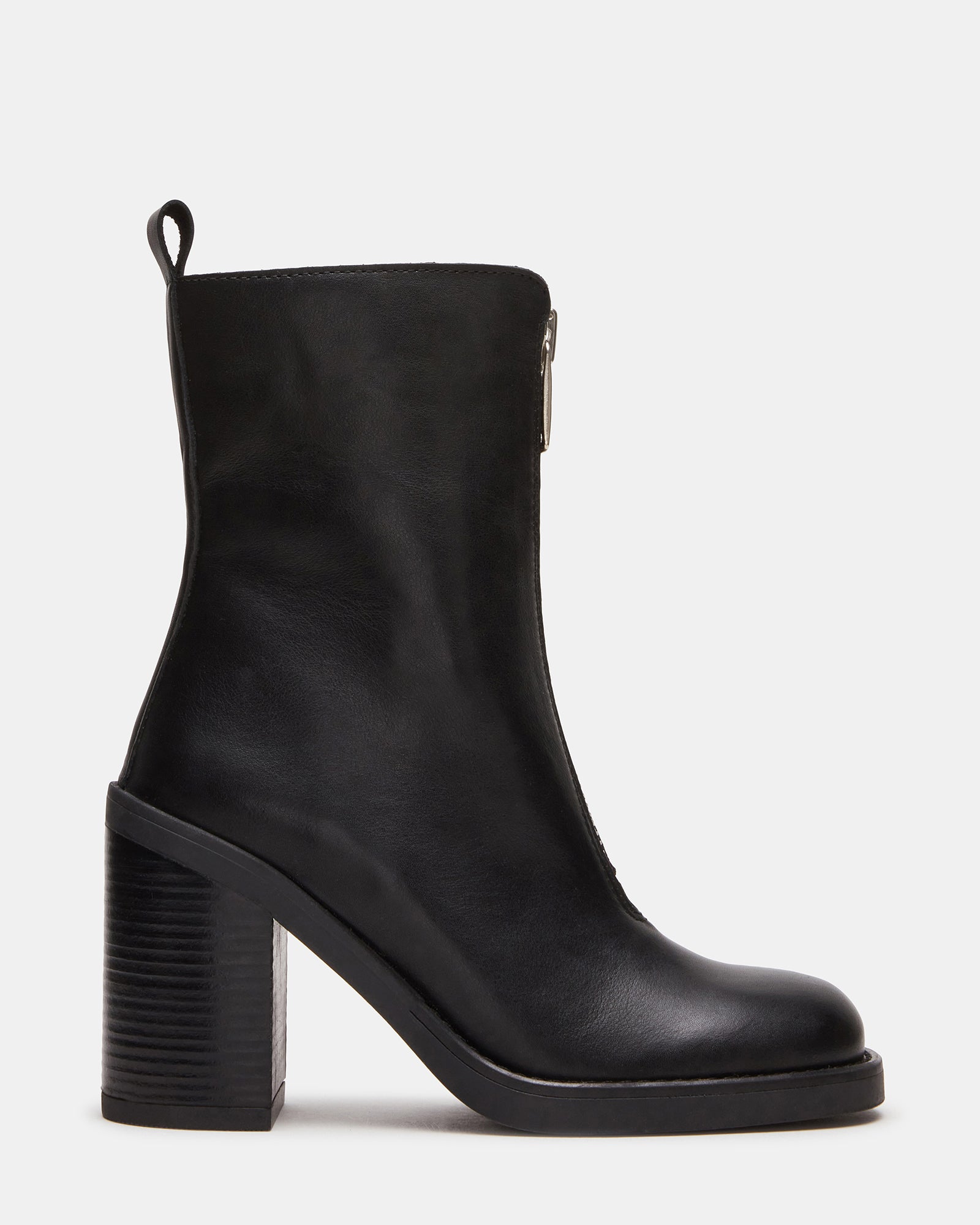 Close-up side view of black ankle boots with block heel and front zip