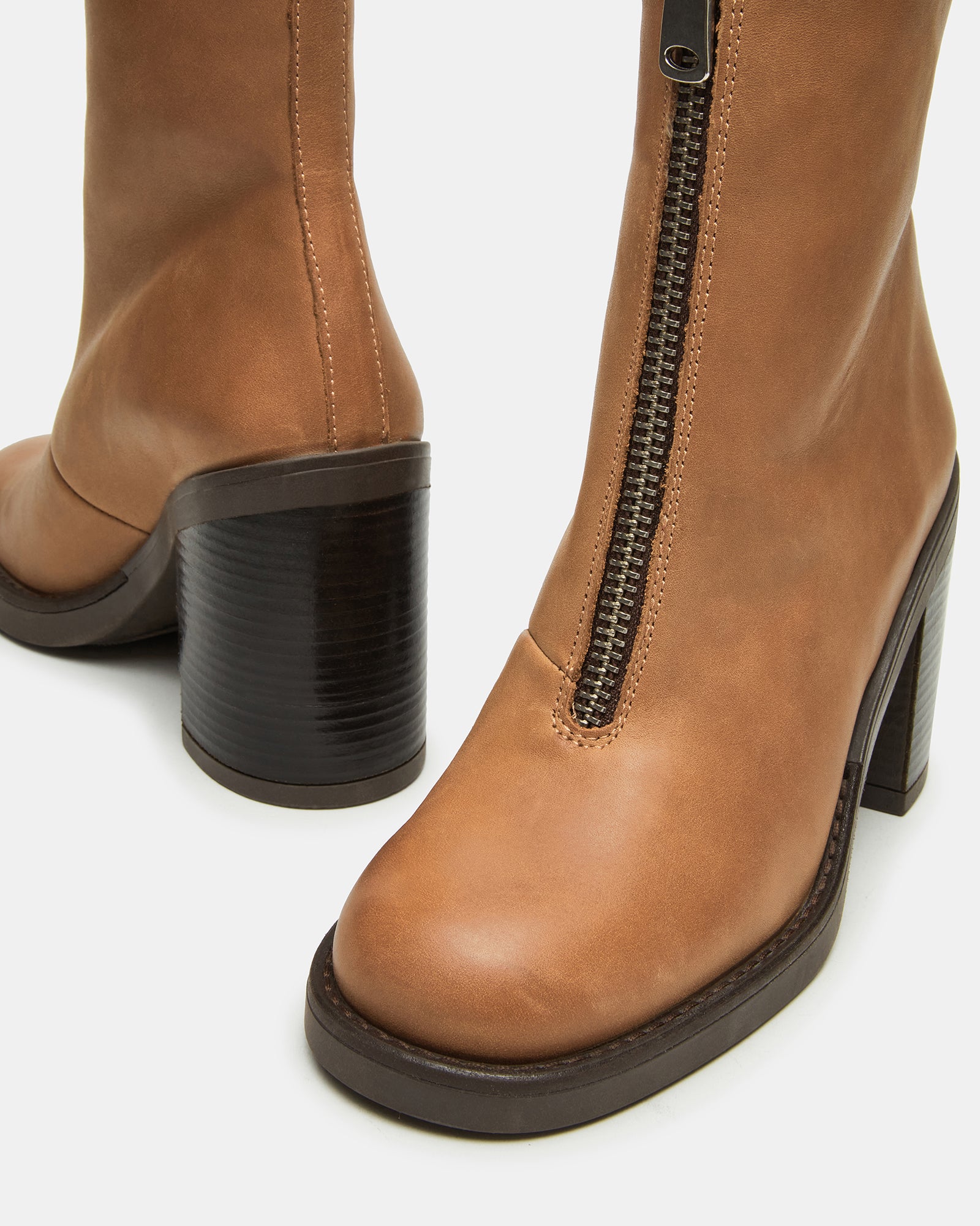 Top-down shot of womens boots block heel styled with jeans for fall outings
