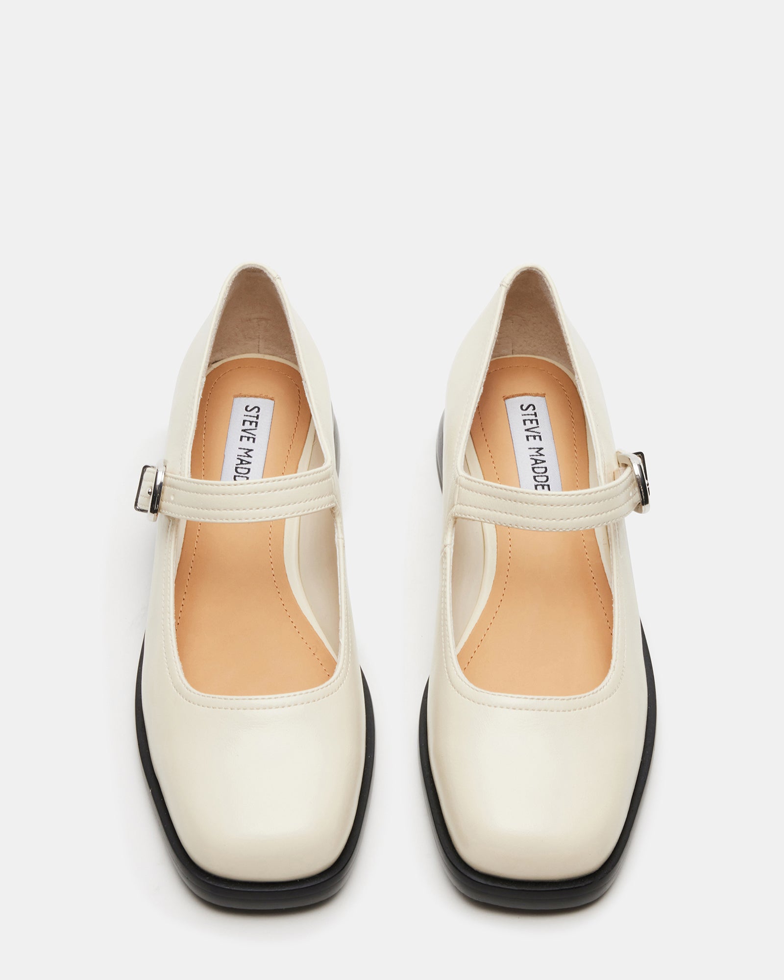 Close-up of Mary Jane strap on black leather ballet flats.