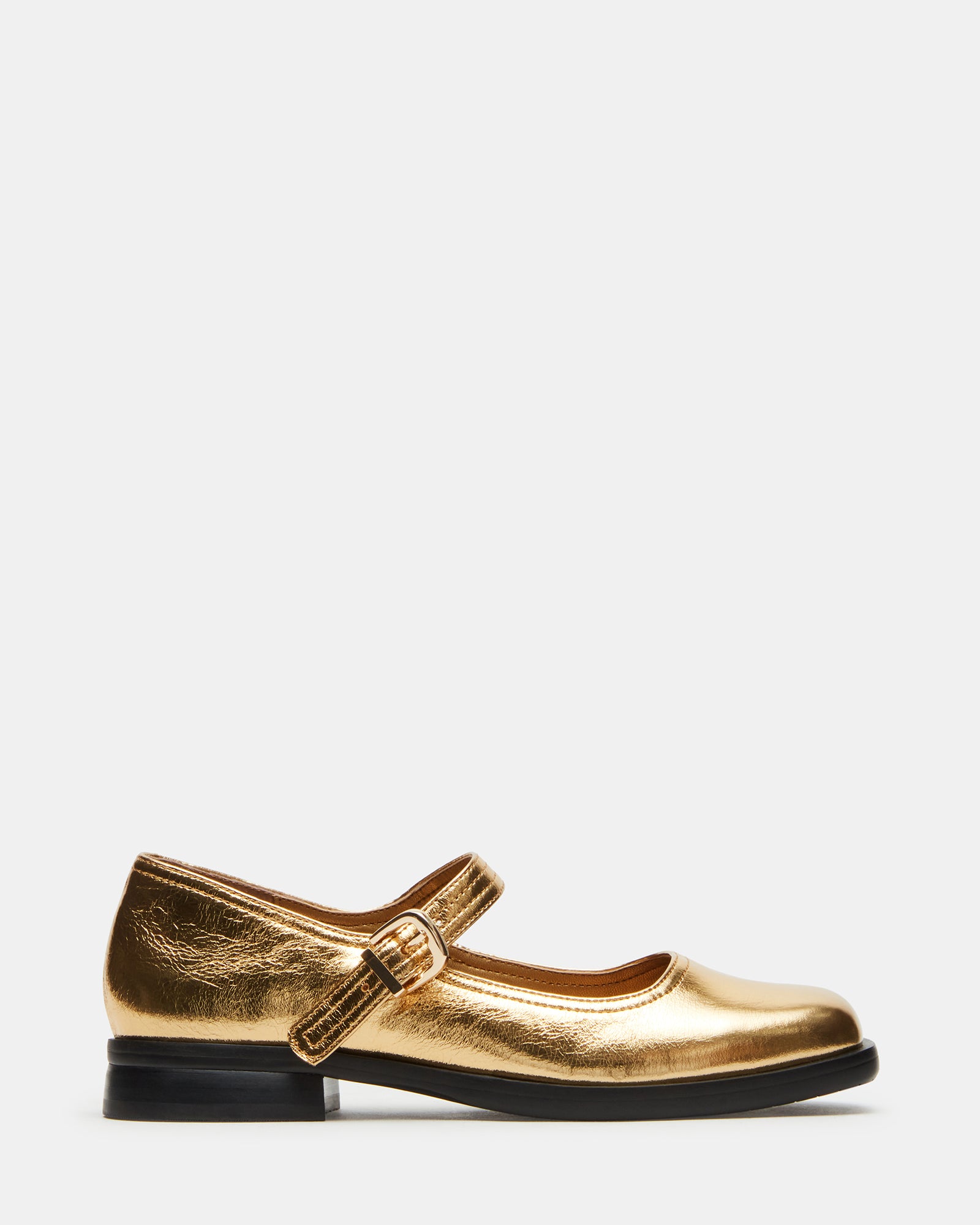 Close-up of square toe ballet flats with gold leather finish and Mary Jane strap.