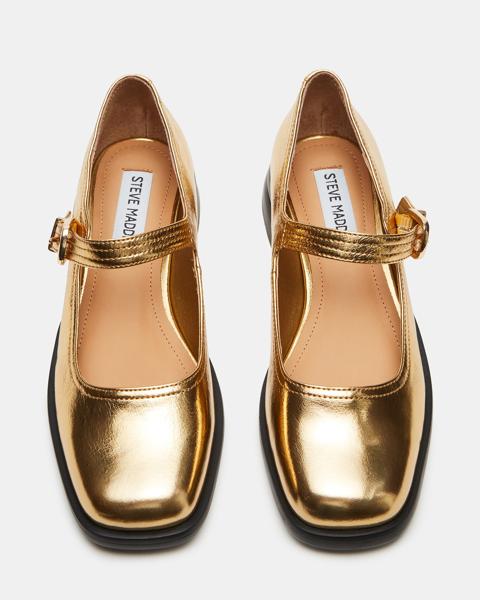 Close-up of square toe ballet flats with gold leather finish and Mary Jane strap.
