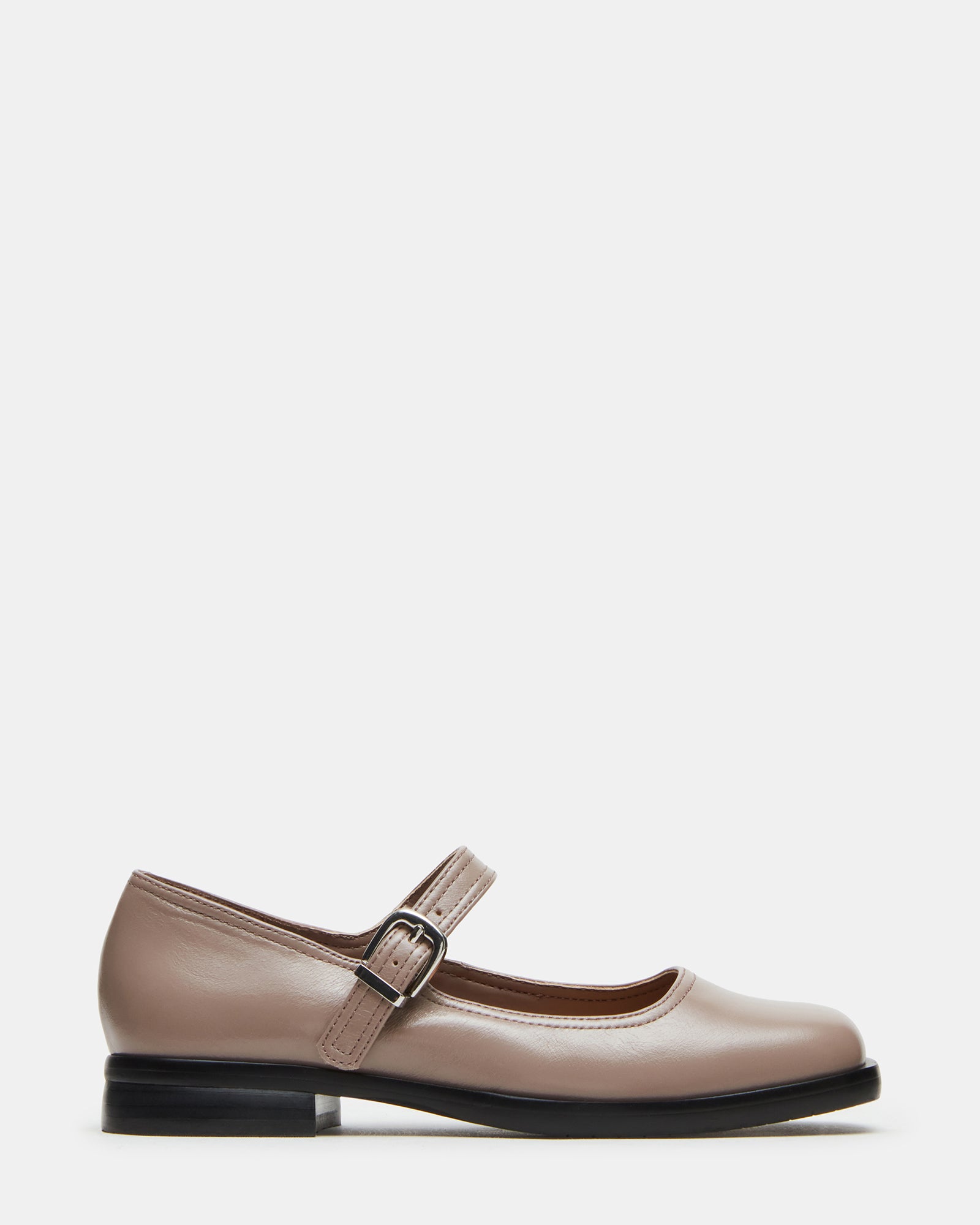 Side view of taupe mary jane shoe showing square toe and 1-inch heel.