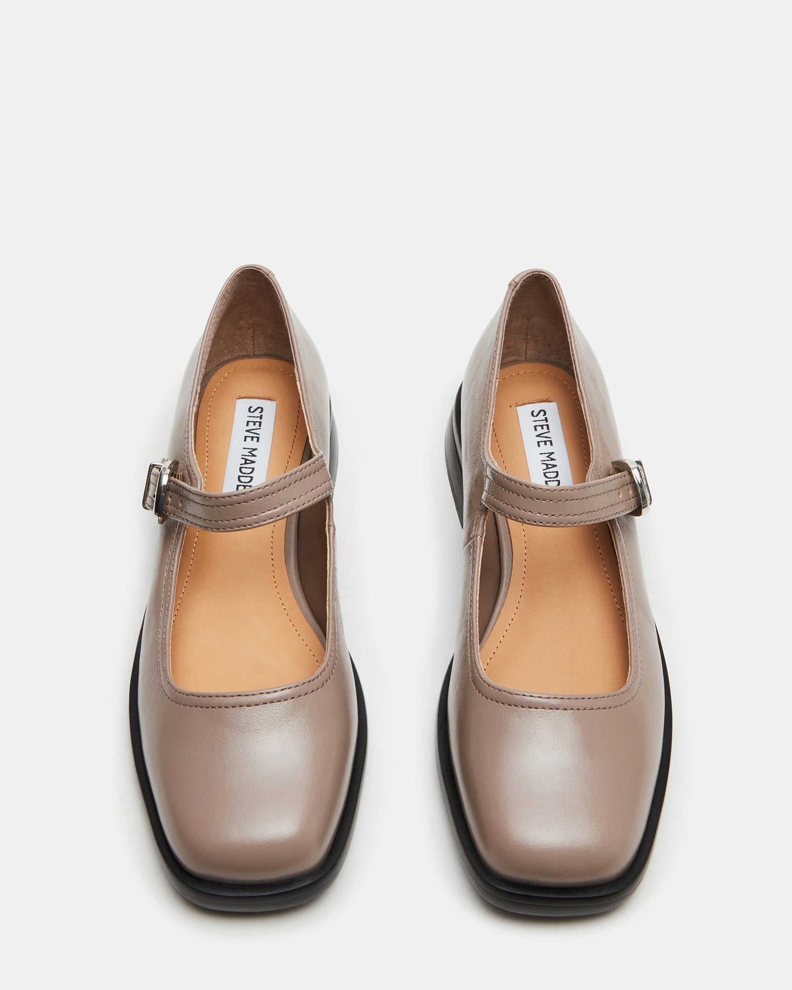 Side view of taupe mary jane shoe showing square toe and 1-inch heel.