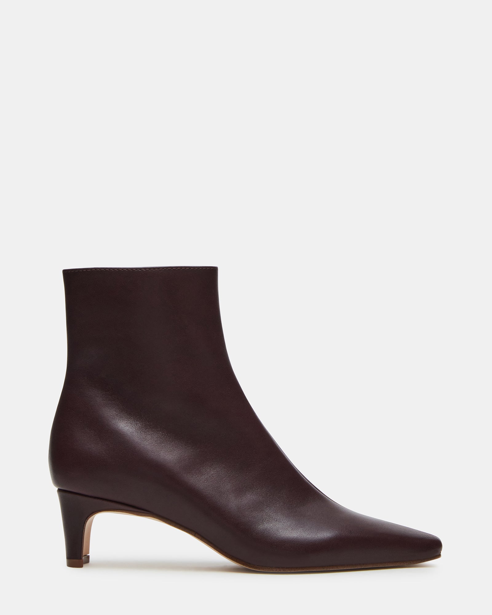 Black kitten heel booties styled with slim-fit trousers for a chic office look