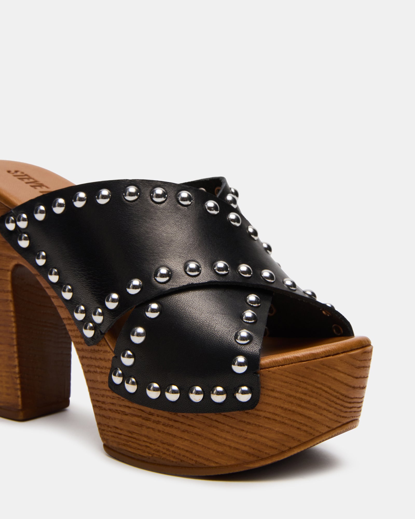 DEMI sandals on foot, showcasing heel height and wood sole