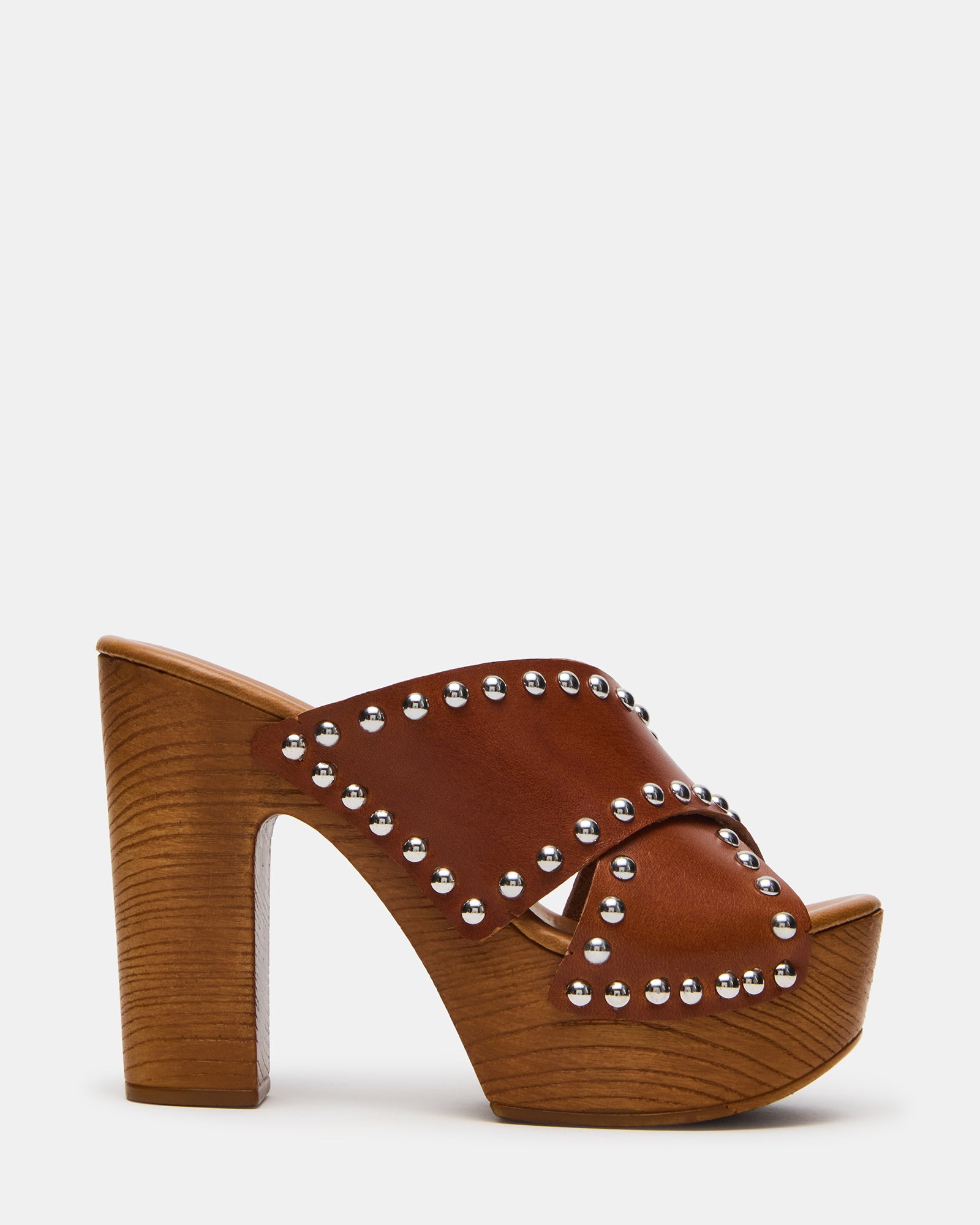 Close-up of cognac leather platform sandals with studded design.