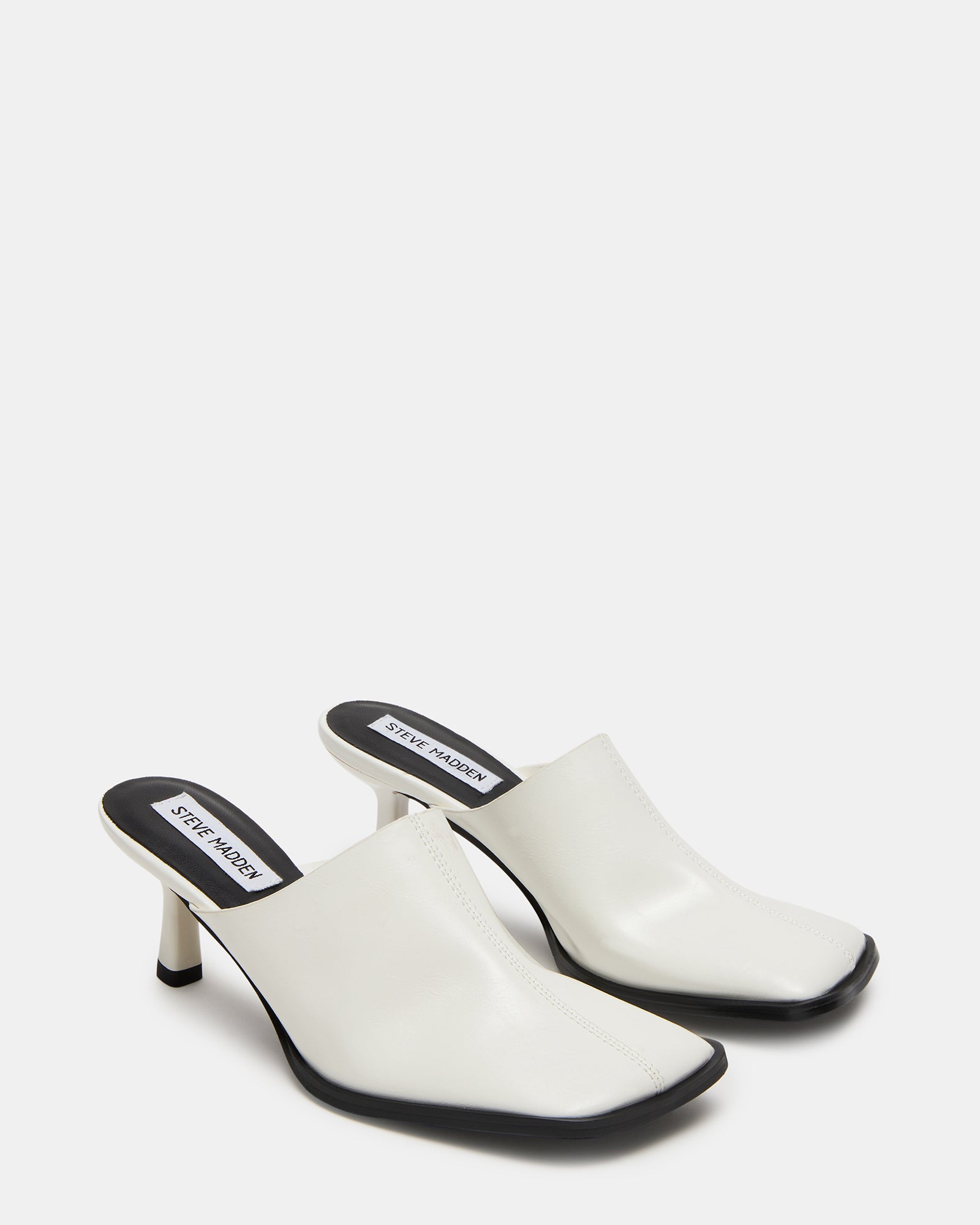 Close-up of ladies leather mules shoes showcasing smooth upper and stitching