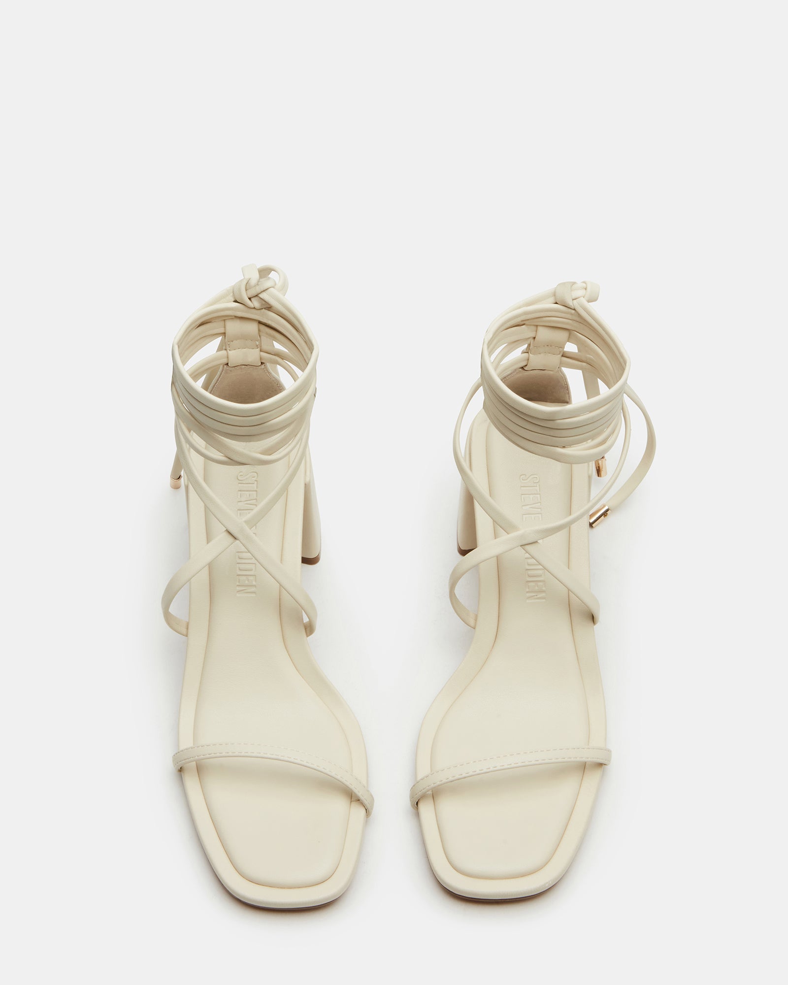Close-up of Demure Bone strappy heels showing square toe and lace-up detail