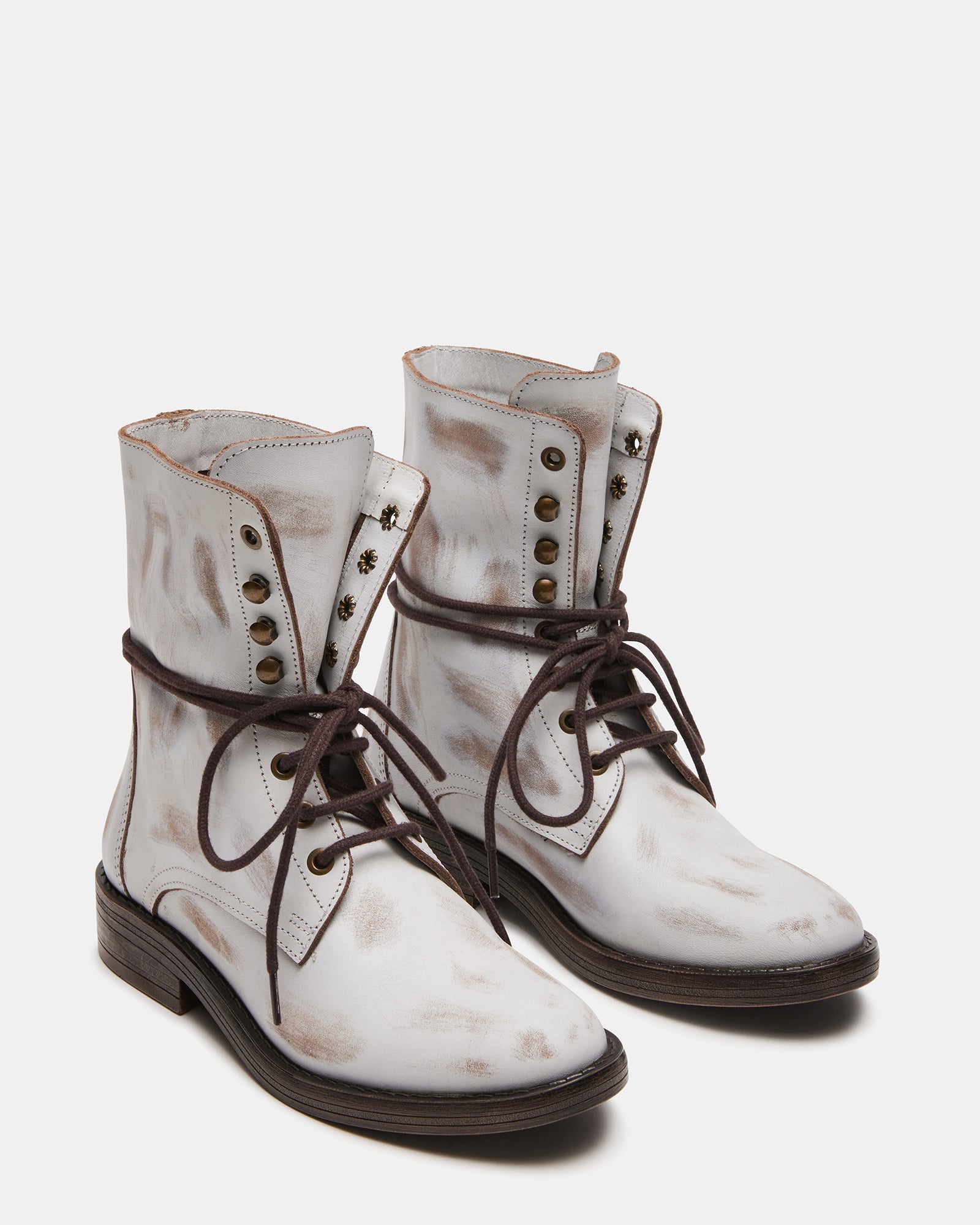 Close-up of the block heel on DEVIE casual brown leather booties.