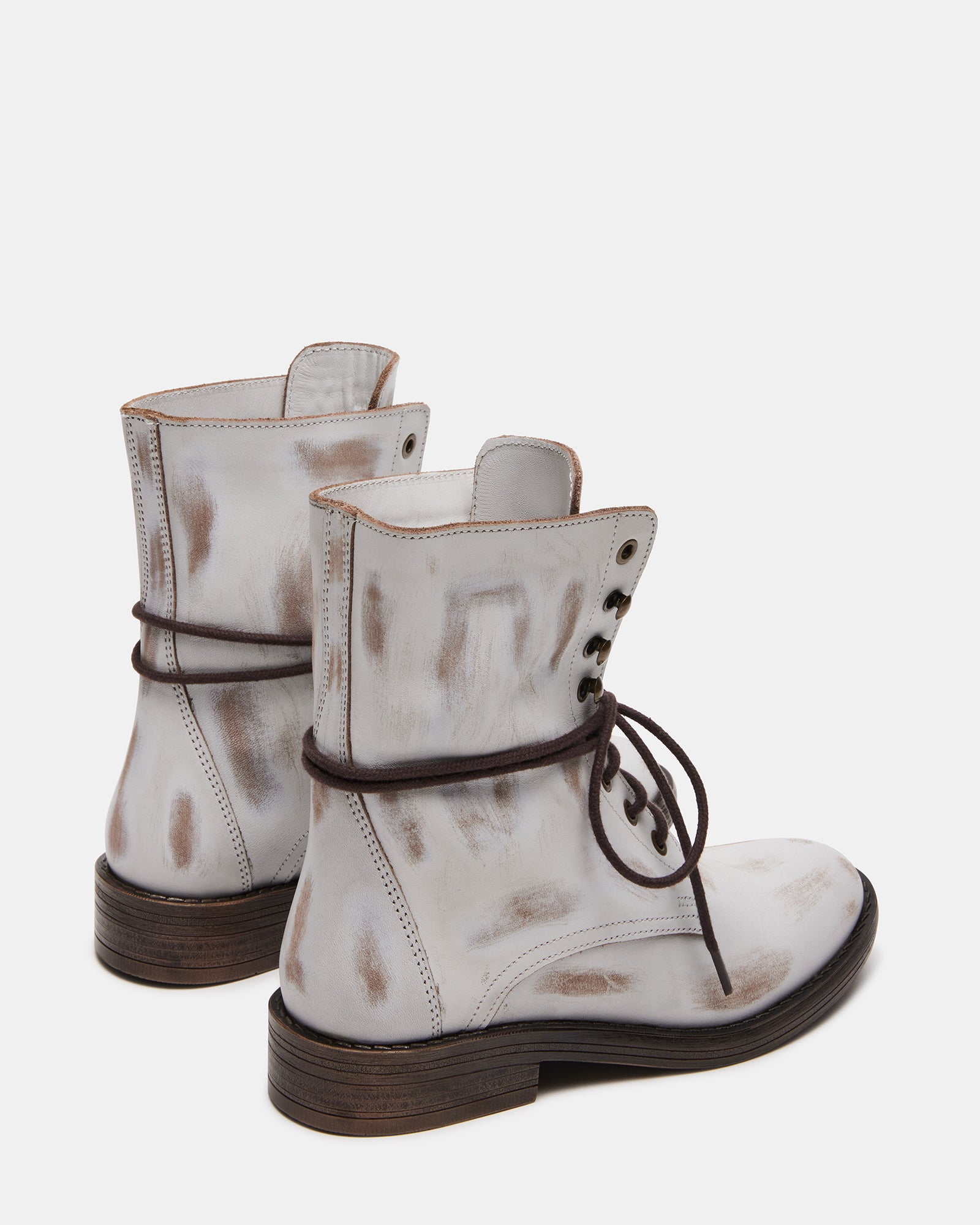 Close-up of the block heel on DEVIE casual brown leather booties.