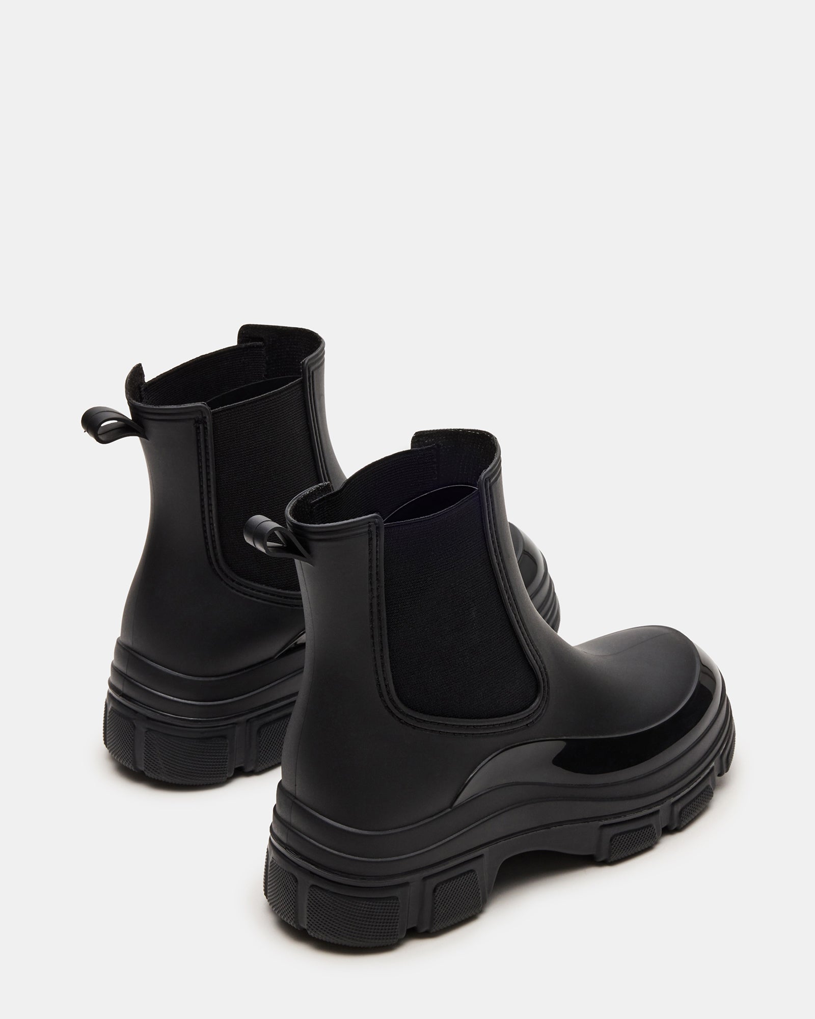 Close-up of Dewdrop Black ankle boots showing the textured sole