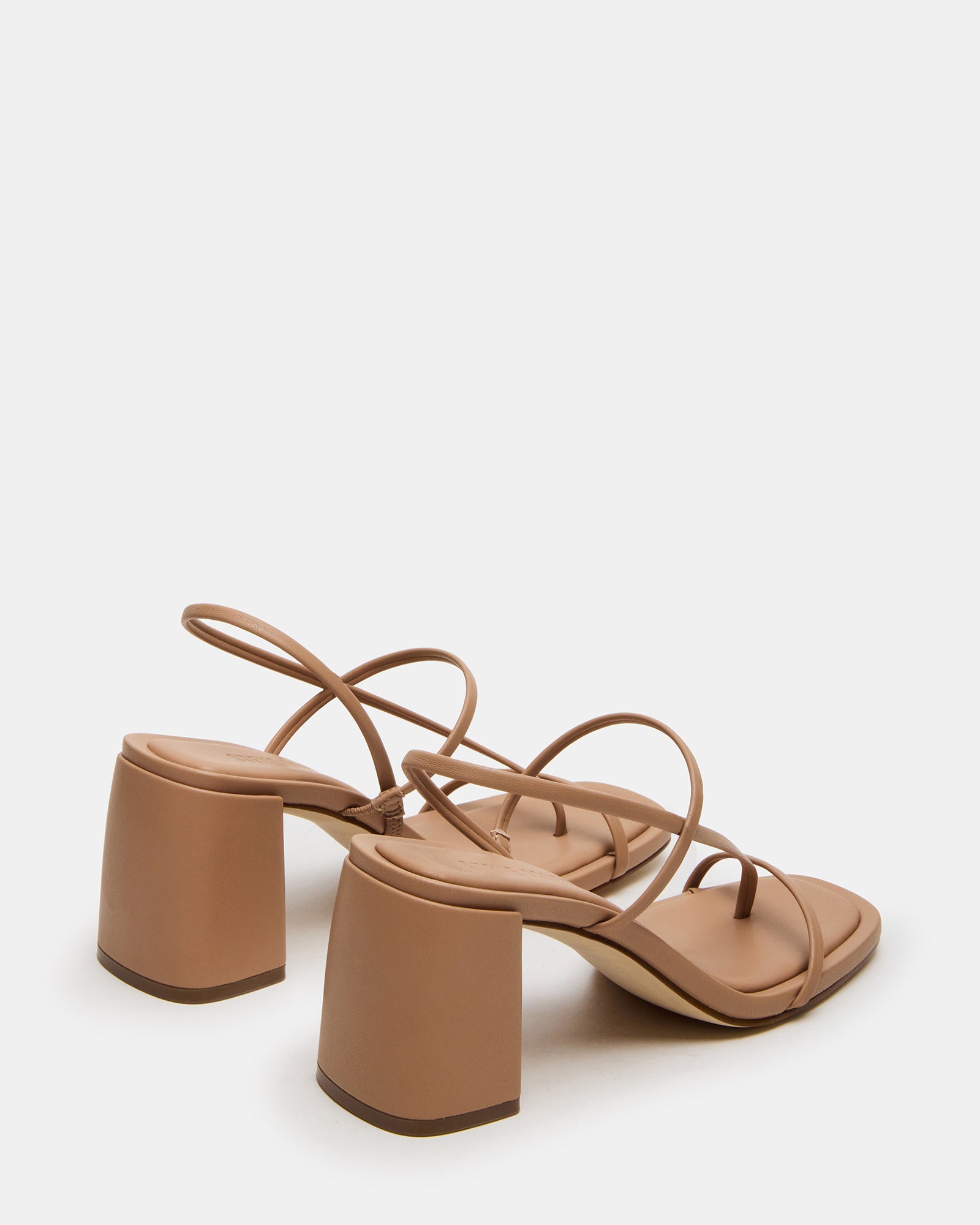 Nude strappy heels paired with cropped trousers for daytime outfit