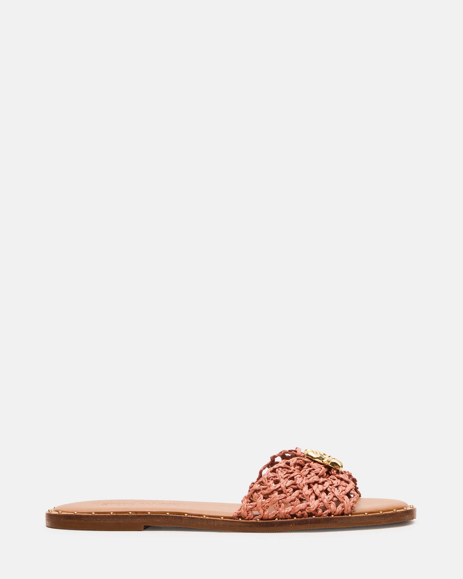 Top view of fashion sandals showcasing suede texture and metallic studs