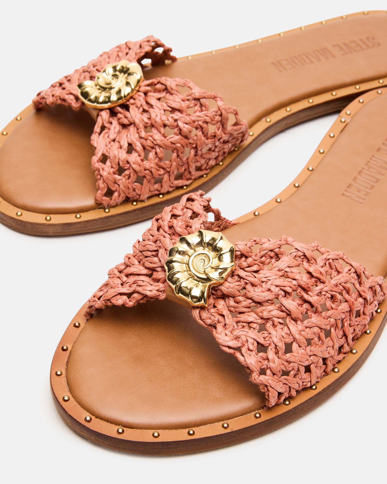 Lifestyle shot of sandals slides shoes womens walking in warm outdoor setting