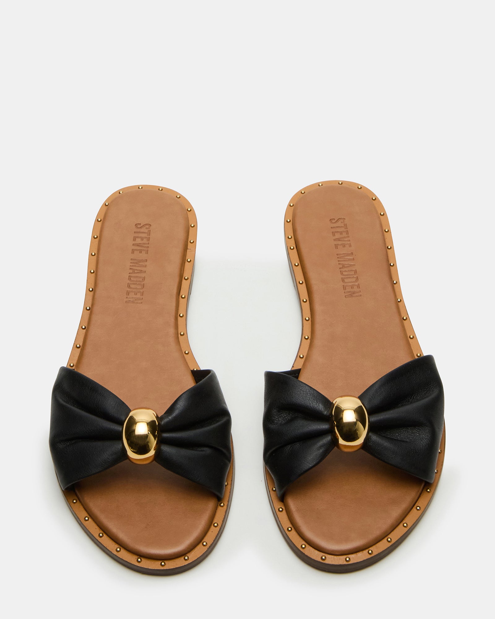 Side view of womens platform sandals on a neutral-toned surface.