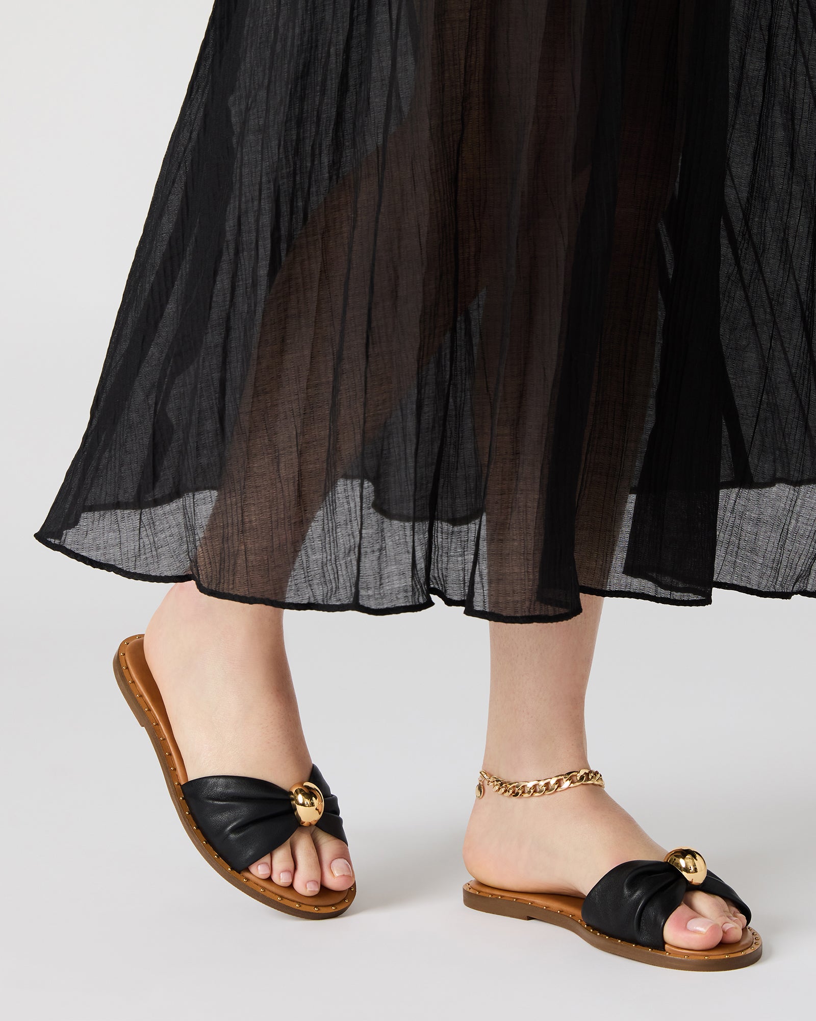 Side view of womens platform sandals on a neutral-toned surface.