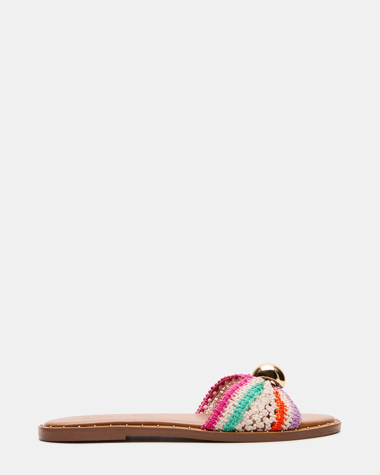 Dipsy Multi raffia slide sandals modeled on feet outdoors