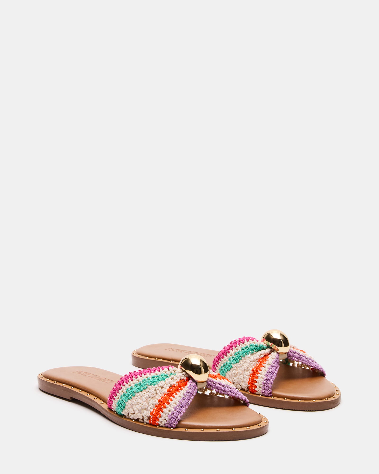 Side view of raffia platform sandals showing natural texture