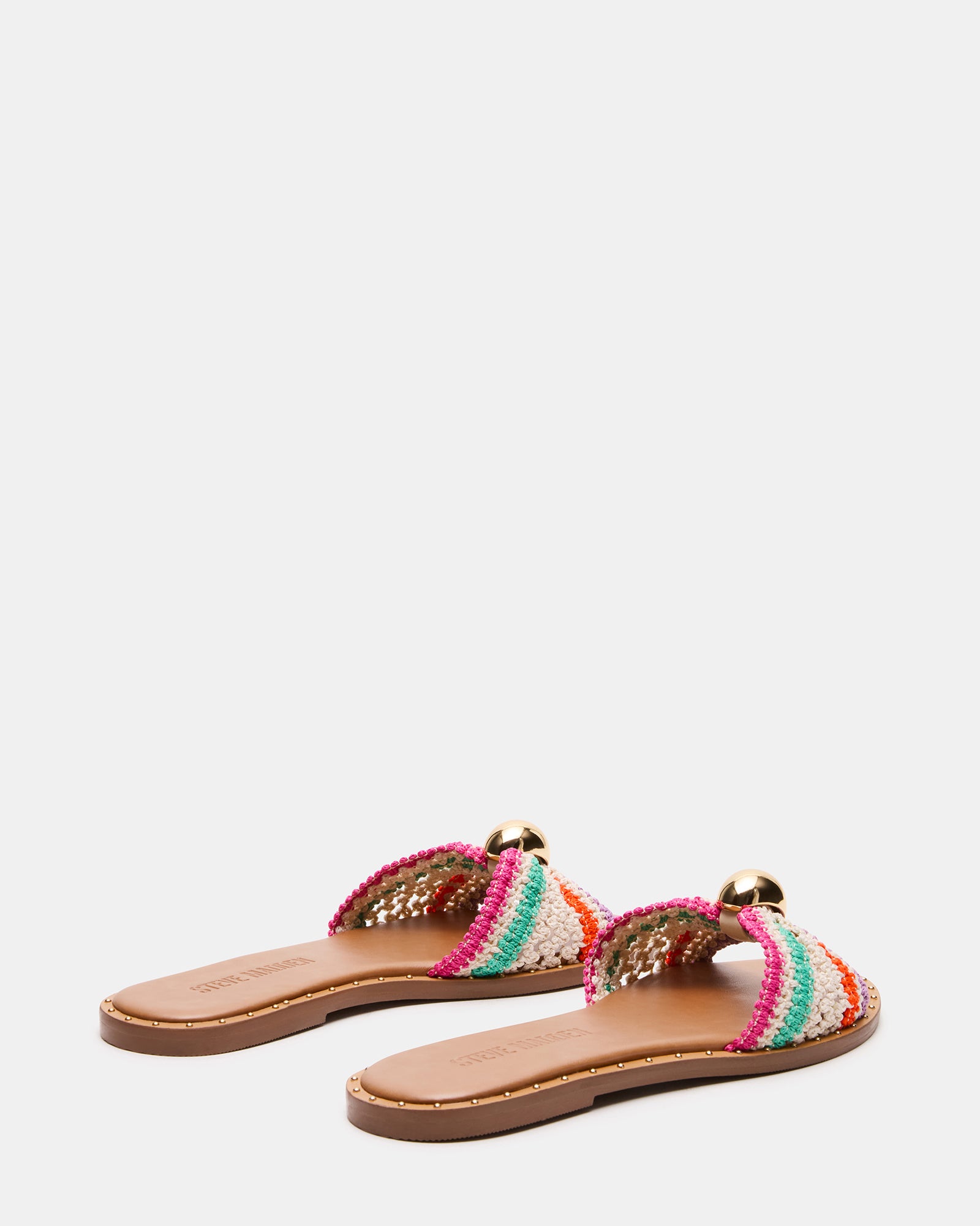 Side view of raffia platform sandals showing natural texture