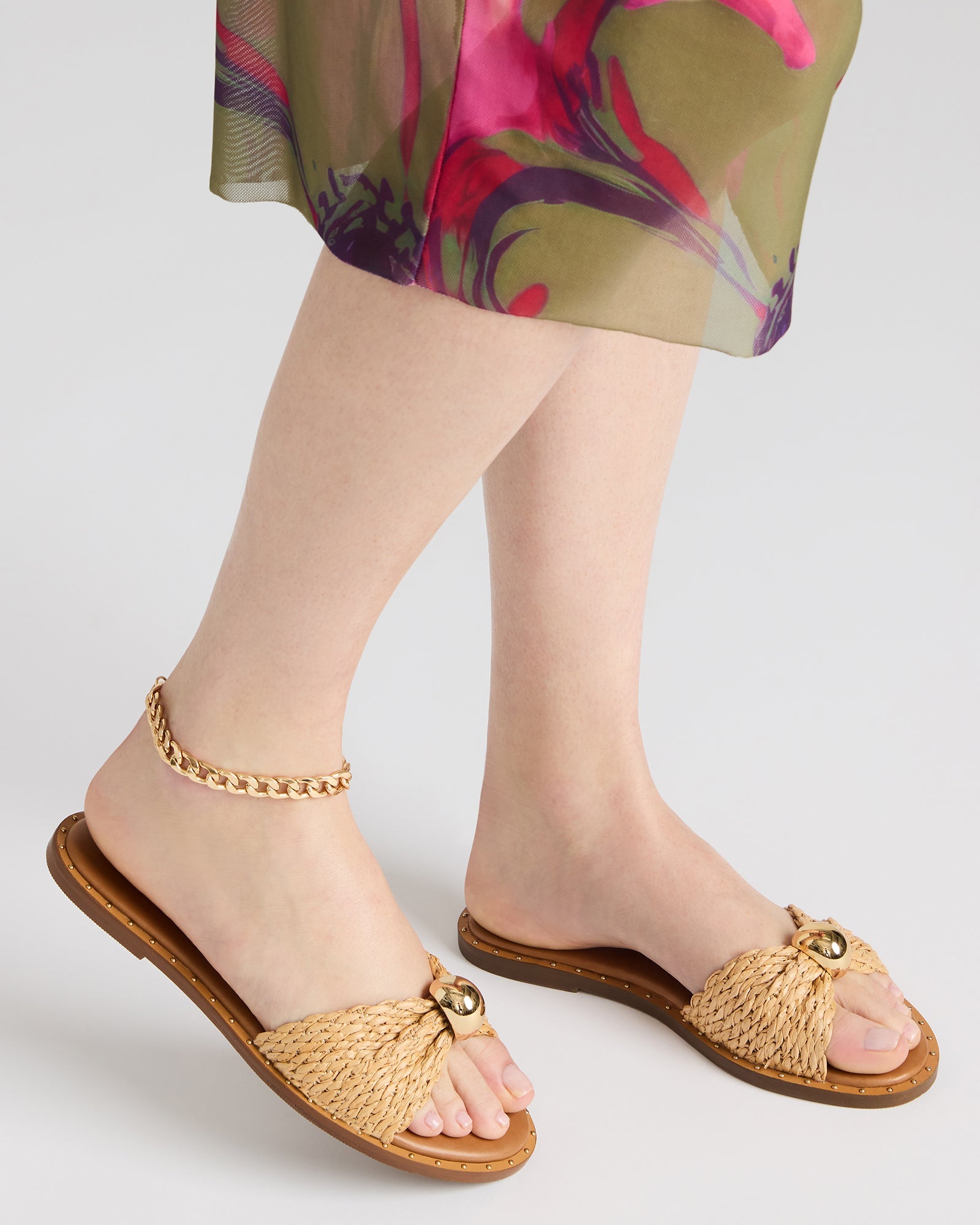 Close-up of the rounded toe and mini studs on DIPSY slide sandals.