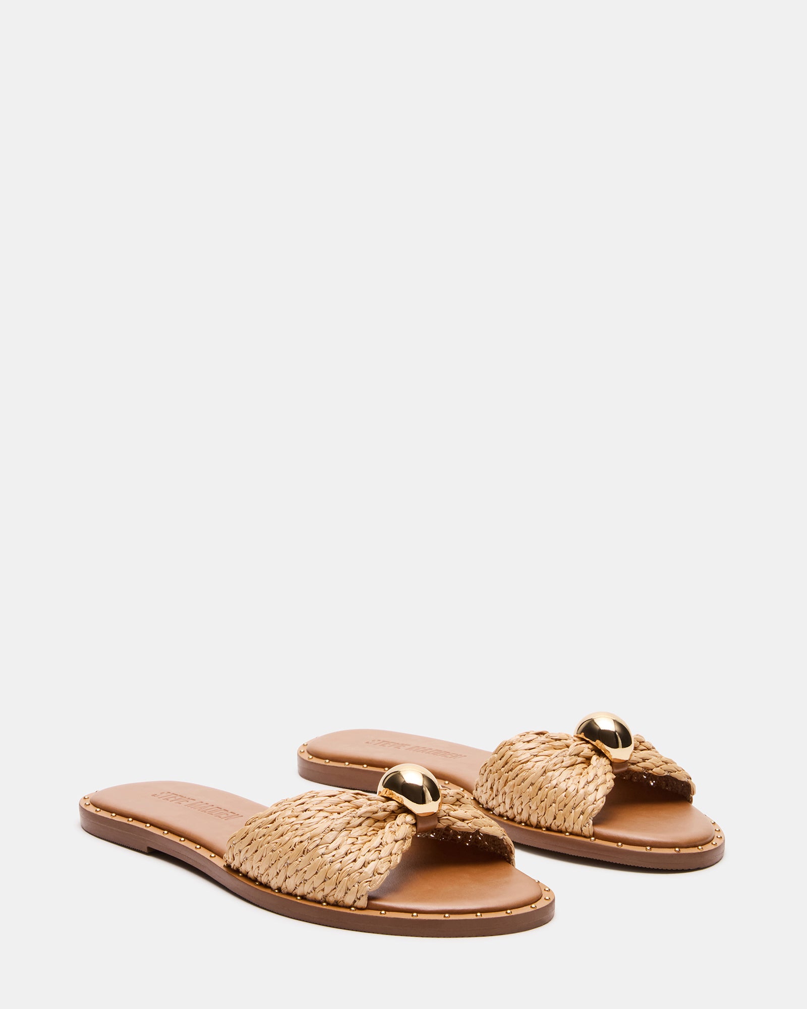 DIPSY raffia sandals worn at a casual summer event.