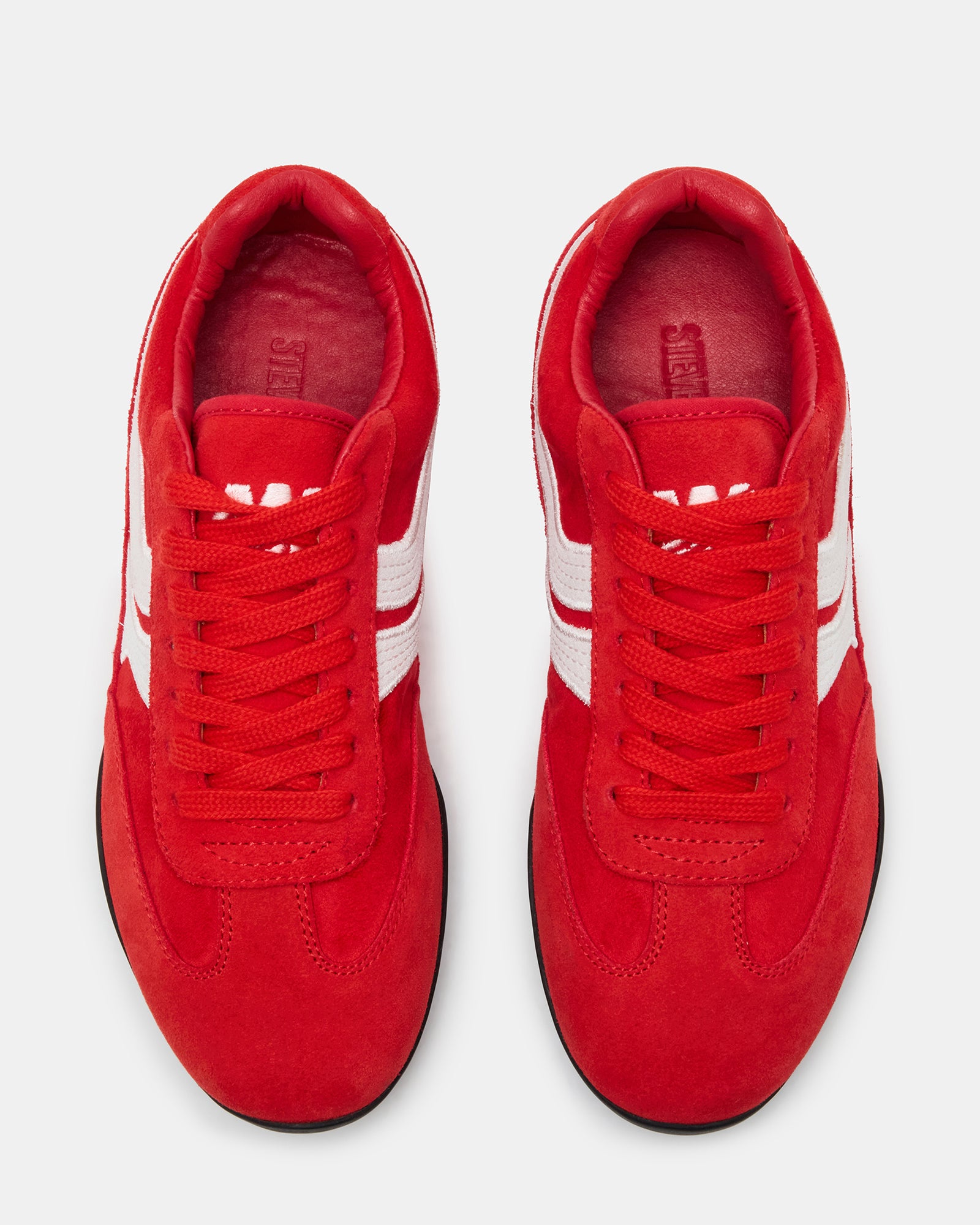 Red Dobson sneaker styled with casual workwear, ideal for nurses and commuters