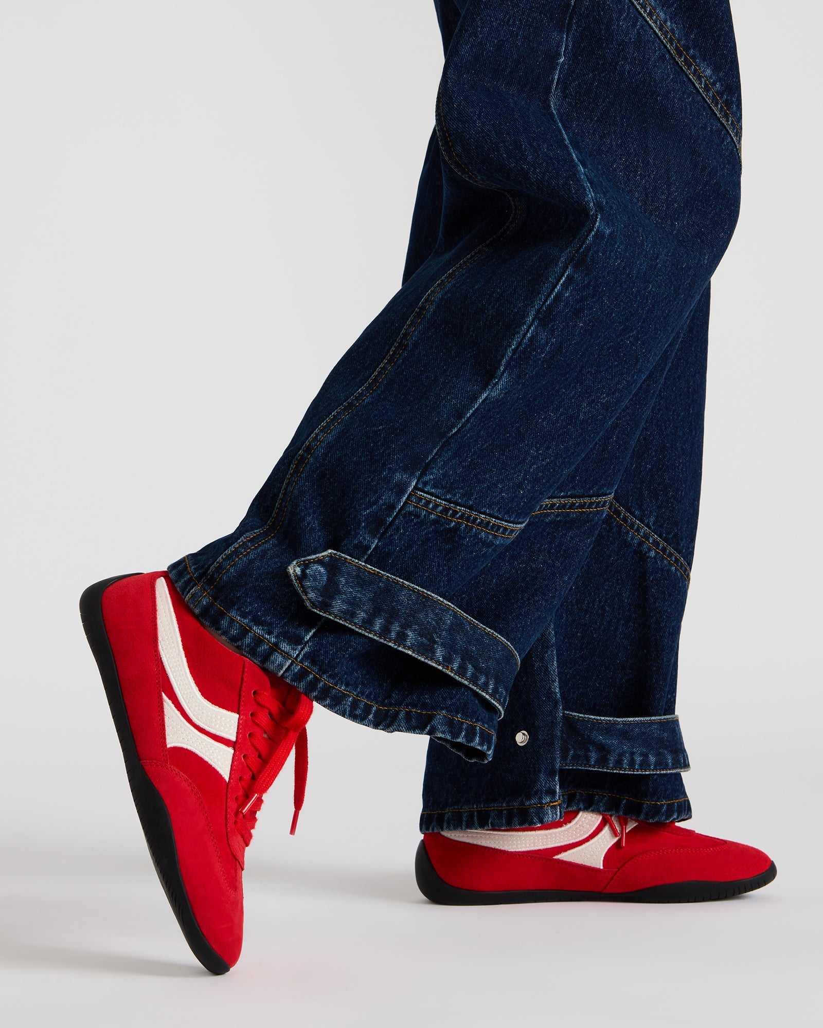 Red Dobson sneaker styled with casual workwear, ideal for nurses and commuters