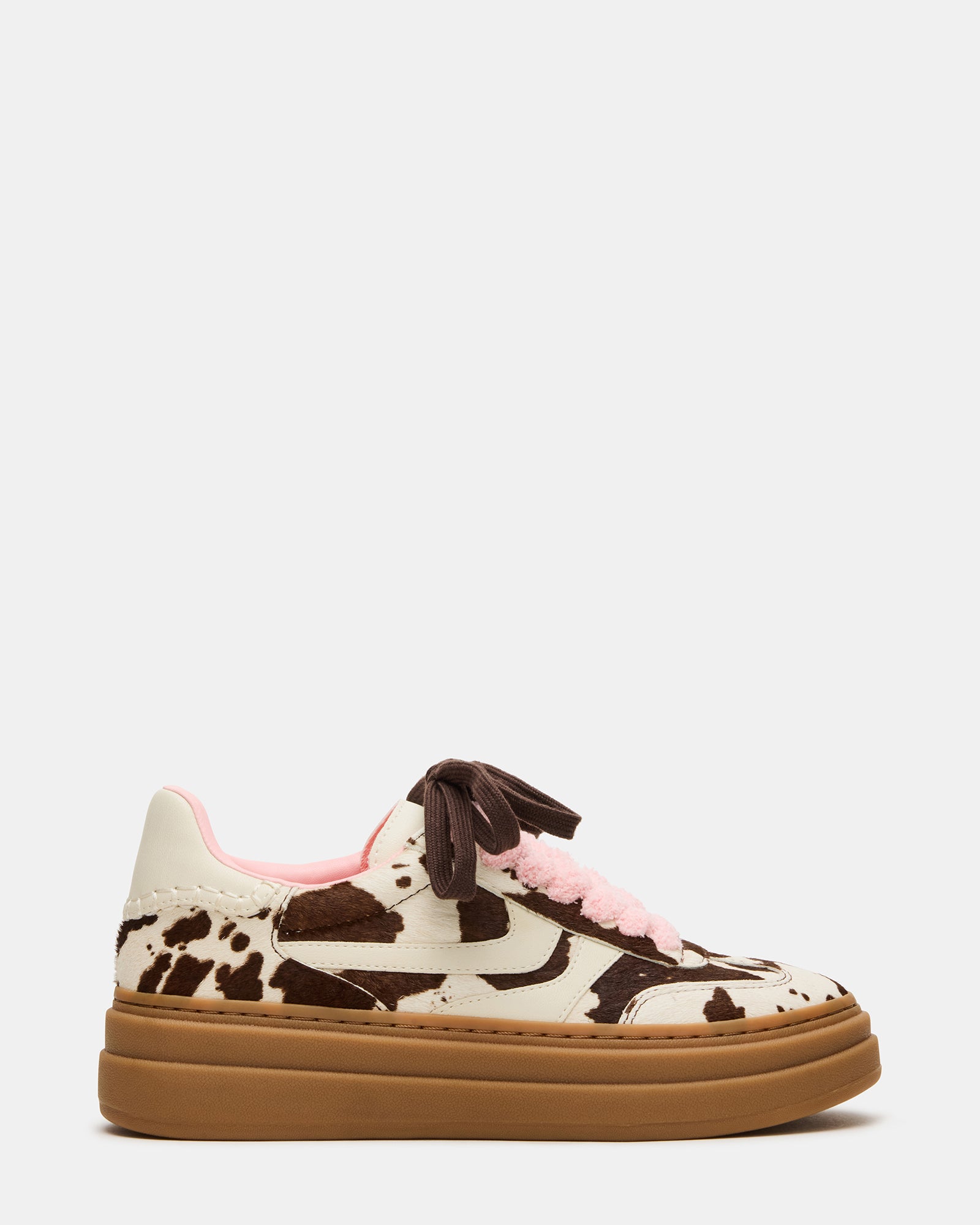 Low-top brown leather sneakers with cow print, perfect for casual outings.