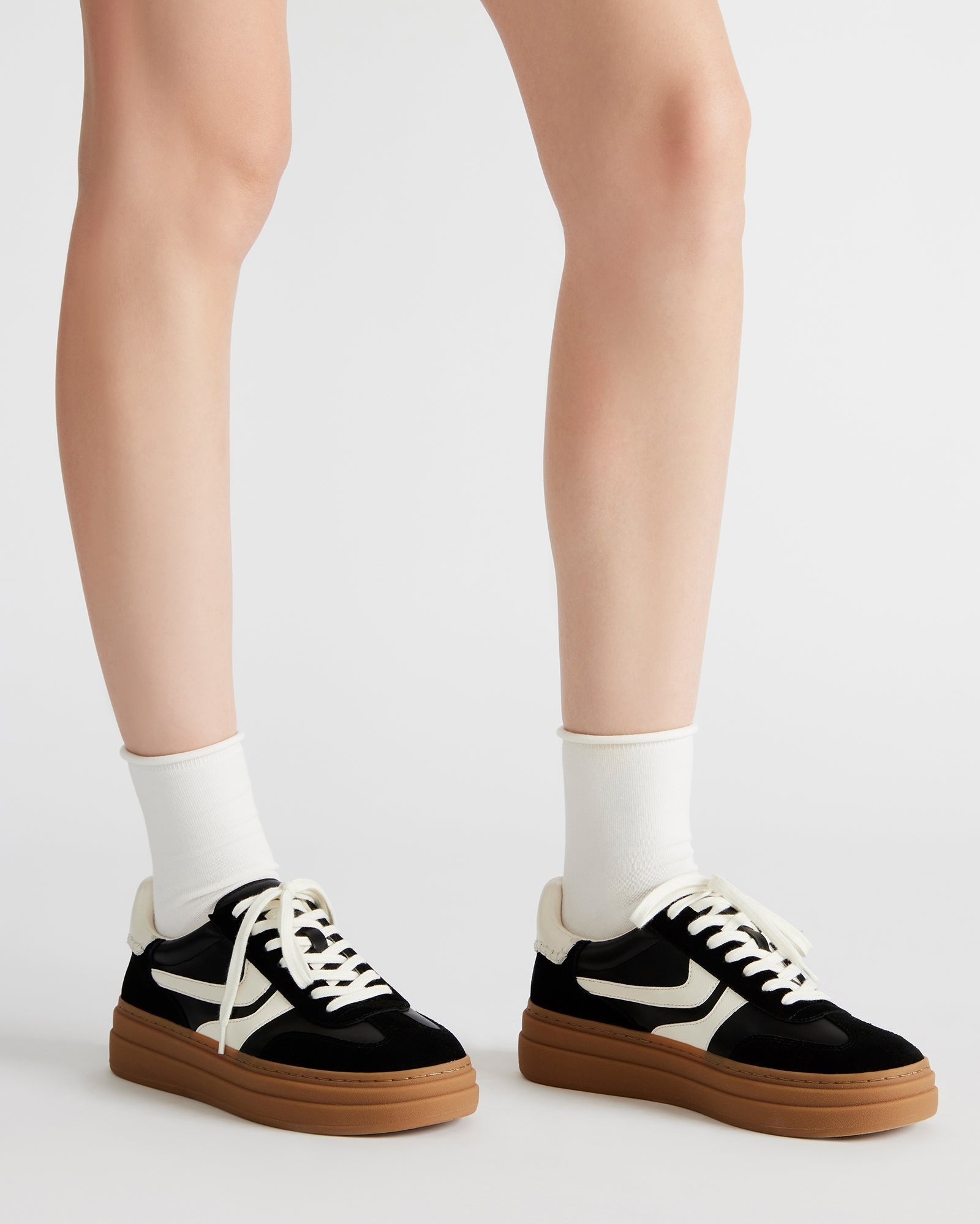 Dodge Navy Bottega Sneakers worn in a casual setting.