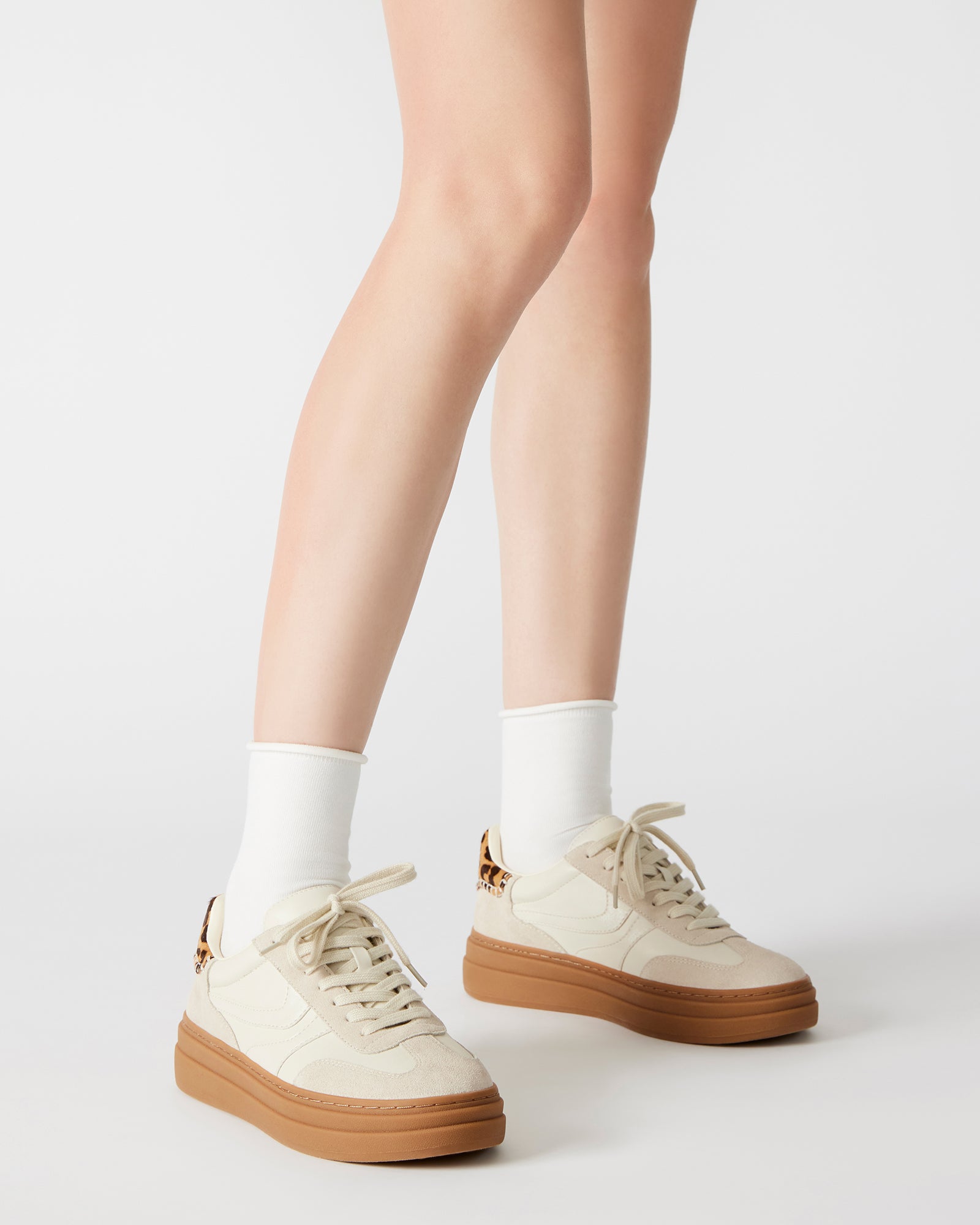 Close-up of DODGE Bone Multi sneakers highlighting lace-up design.