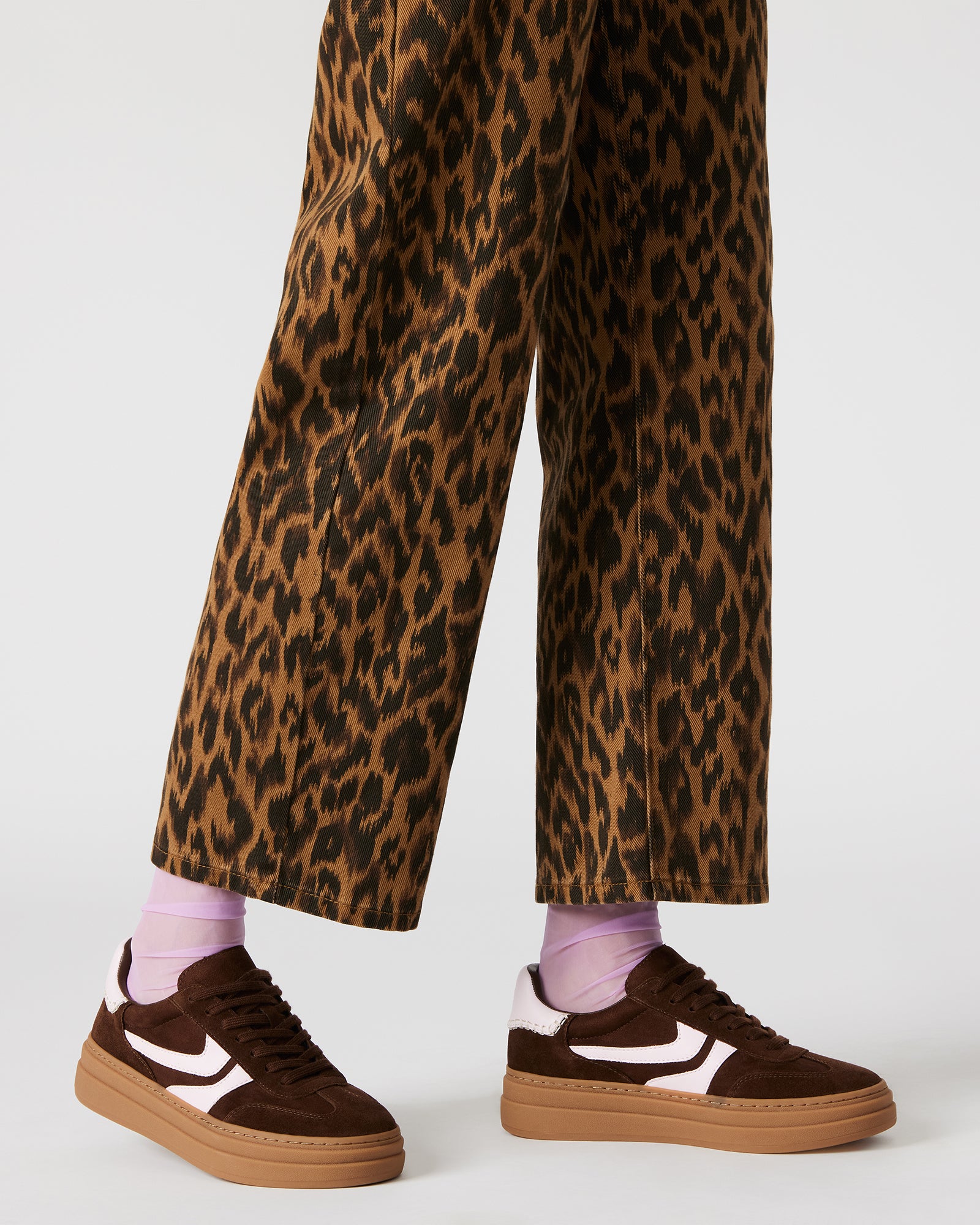 Close-up of lace-up design on mens casual shoes with suede and textile accents