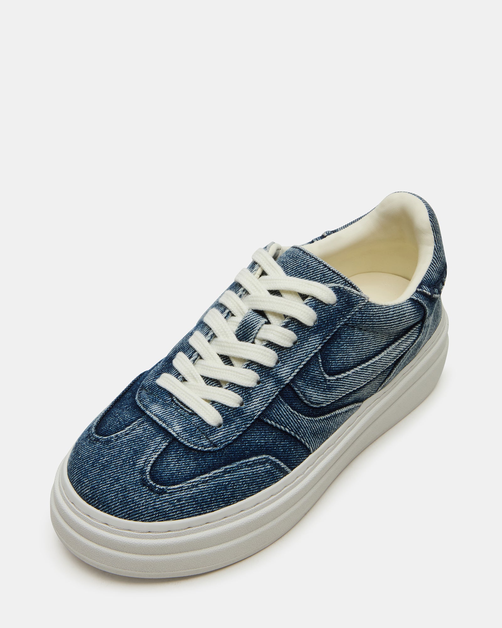Close-up of the breathable textile upper and lace-up detail