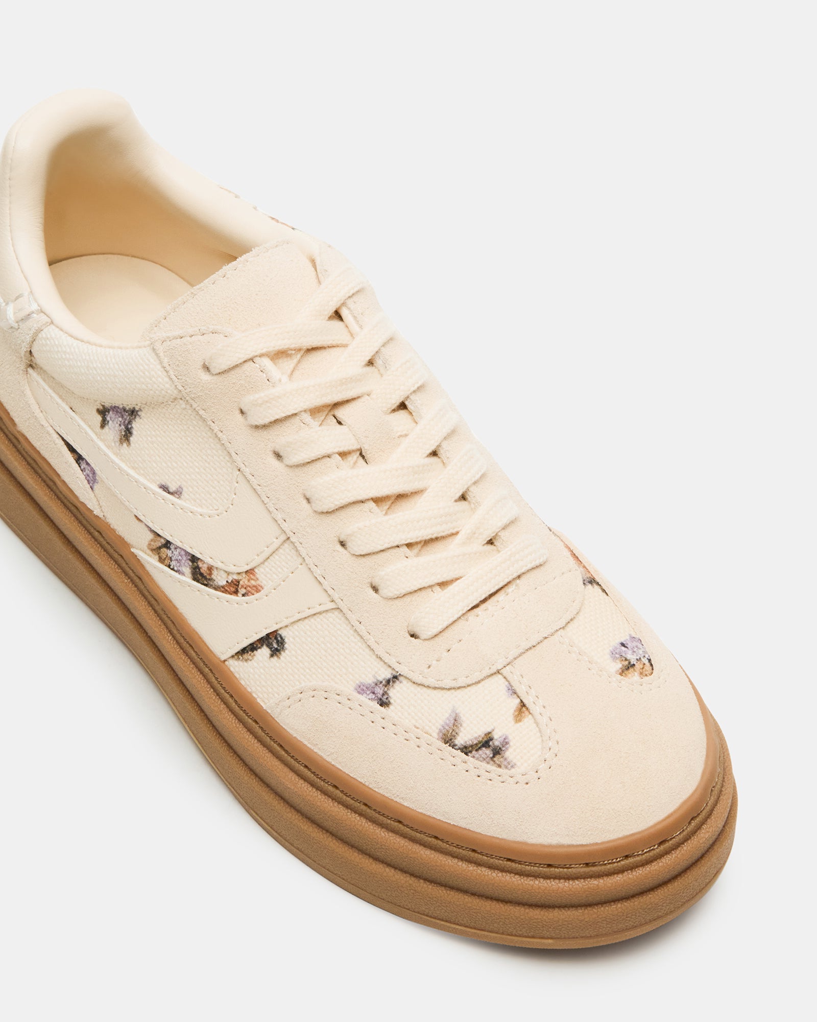 DODGE Floral Multi sneakers displayed against a casual outdoor backdrop.